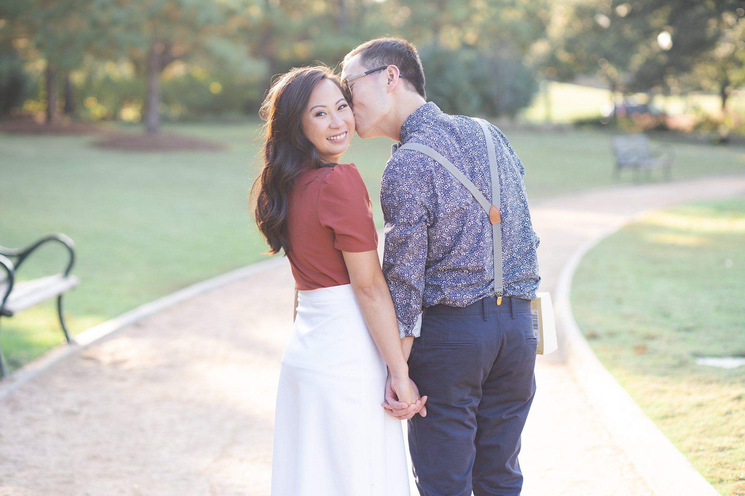 brides smiles during engagement session at the Peach Orchard in Houston Texas by Swish and Click Photography