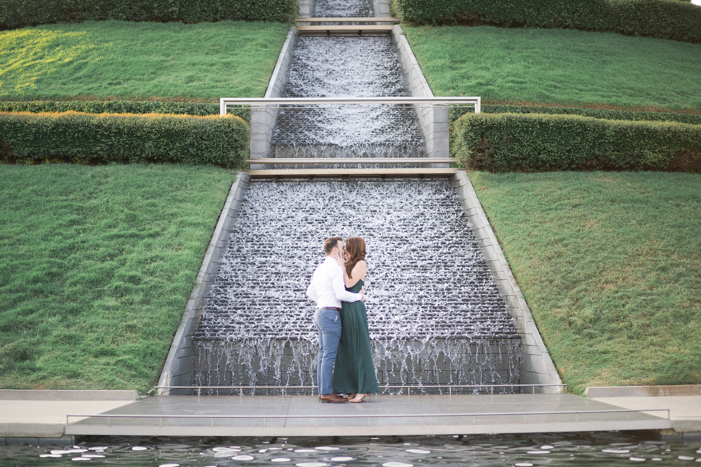 couples kisses during their engagement session at McGovern Centennial Gardens in Houston Texas by Swish and Click Photography
