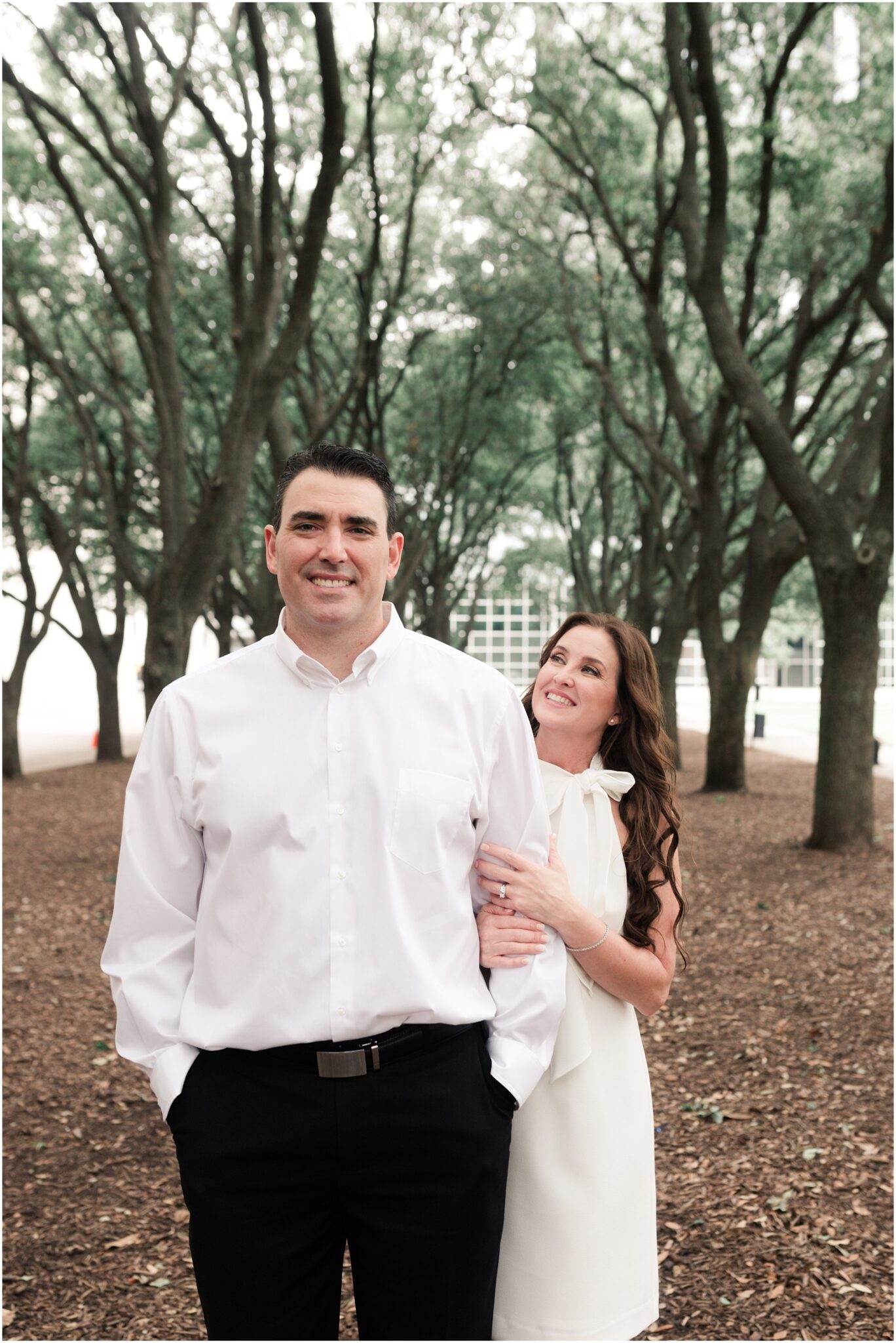 romantic engagement session at the water wall in Houston, Texas photographed by Swish and Click Photography