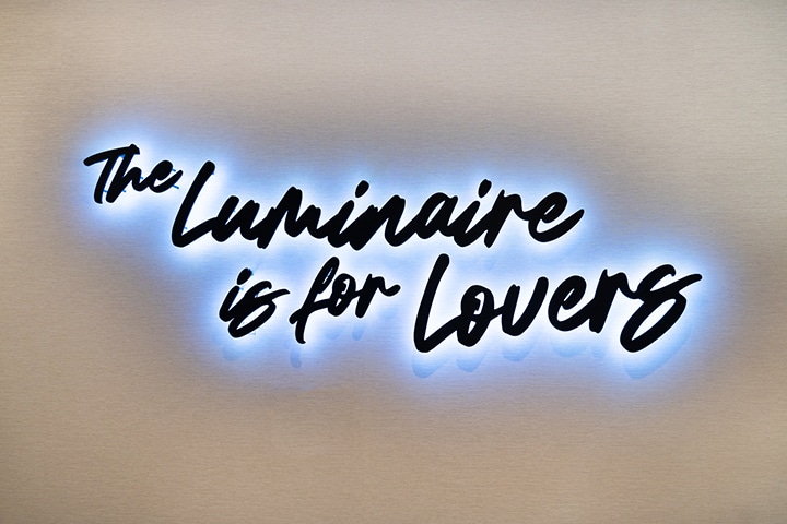 The Luminaire Houston wedding venue at their open house neon sign "the Luminaire is for Lovers' captured by Swish and Click Photography