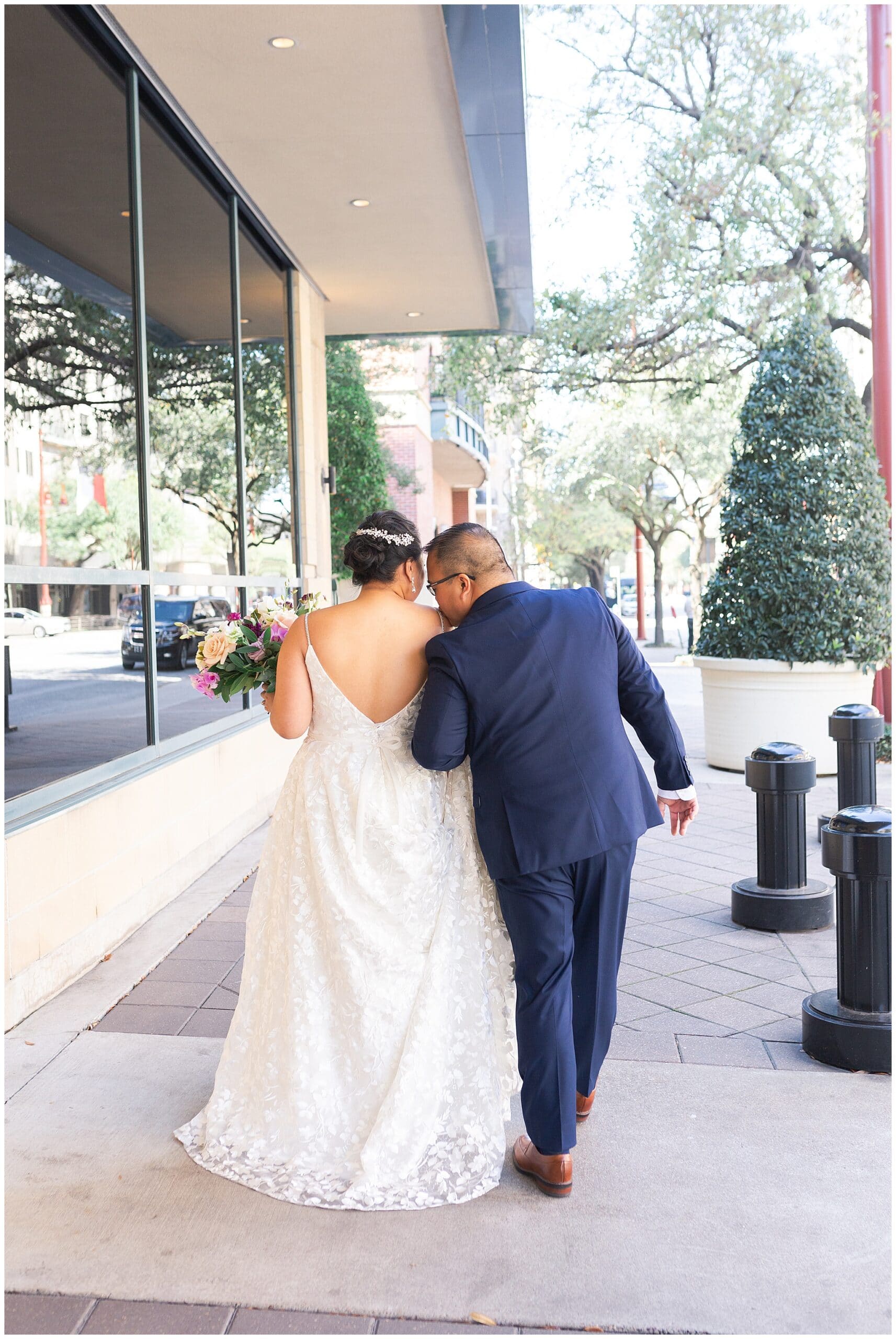 bride and groom do their first look at The Westin in downtown Houston, Texas by Swish and Click Photography