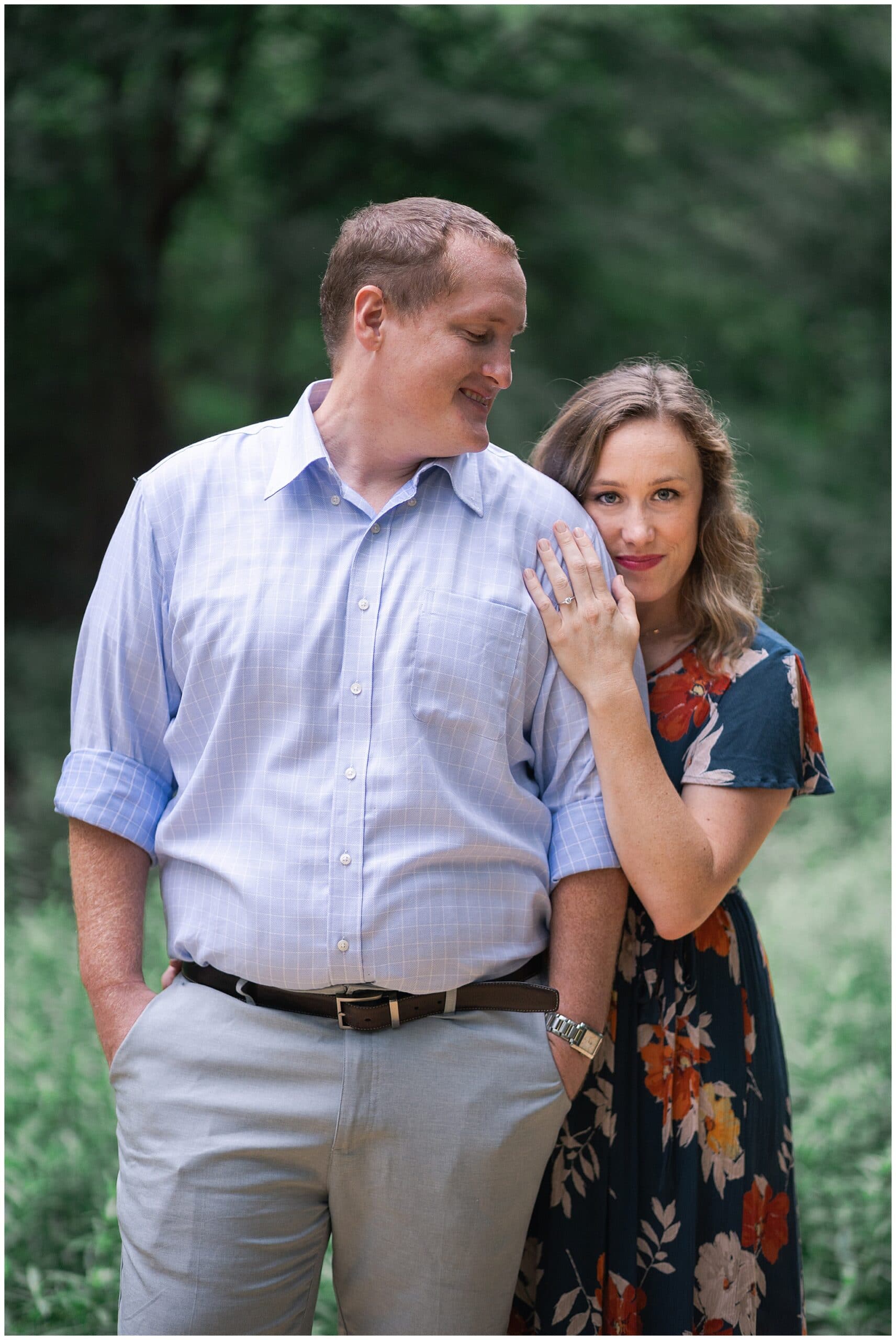 engaged couple smile at the Houston Arboretum in Houston Texas by Swish and Click Photography