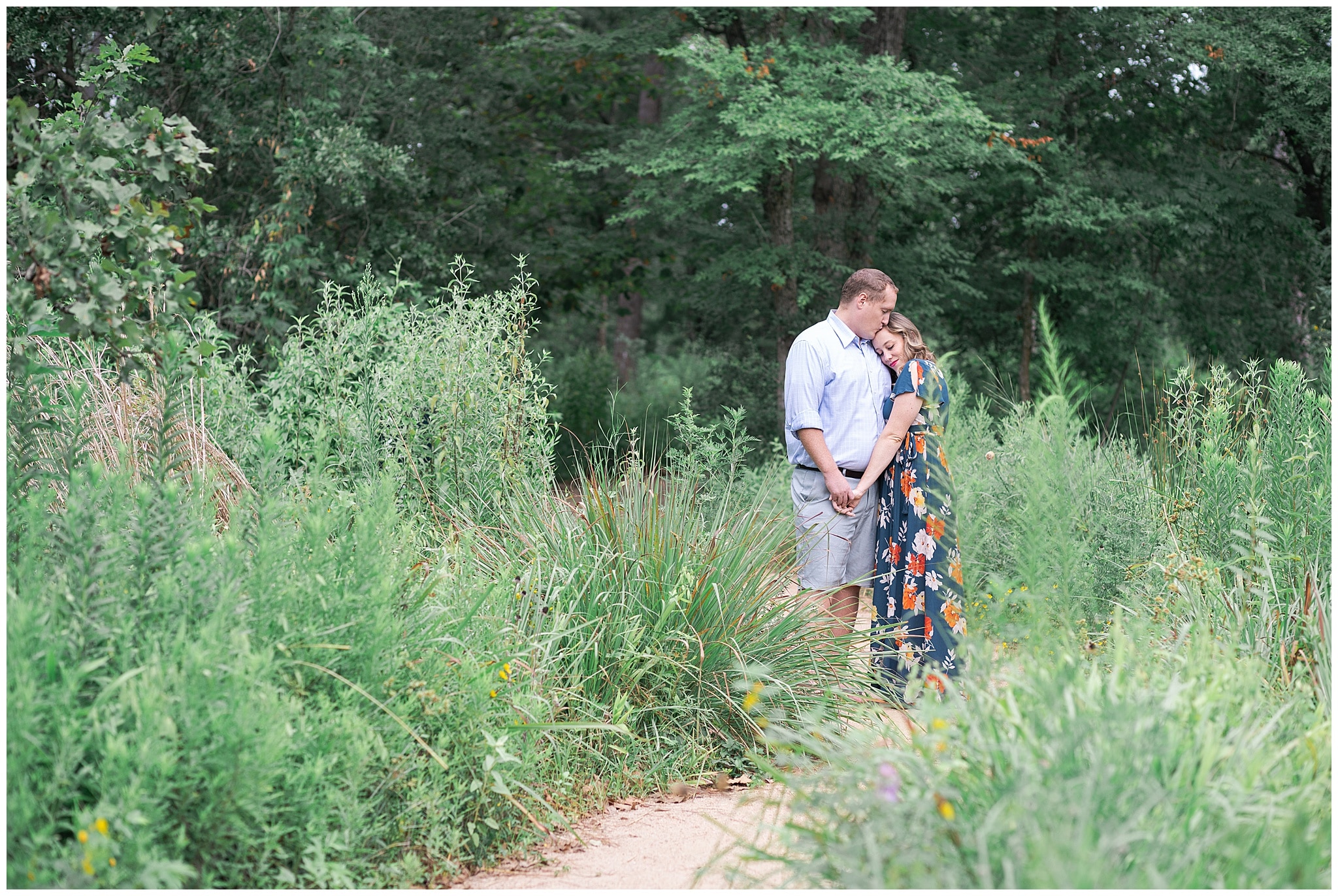 engaged couple pause at the Houston Arboretum in Houston Texas by Swish and Click Photography