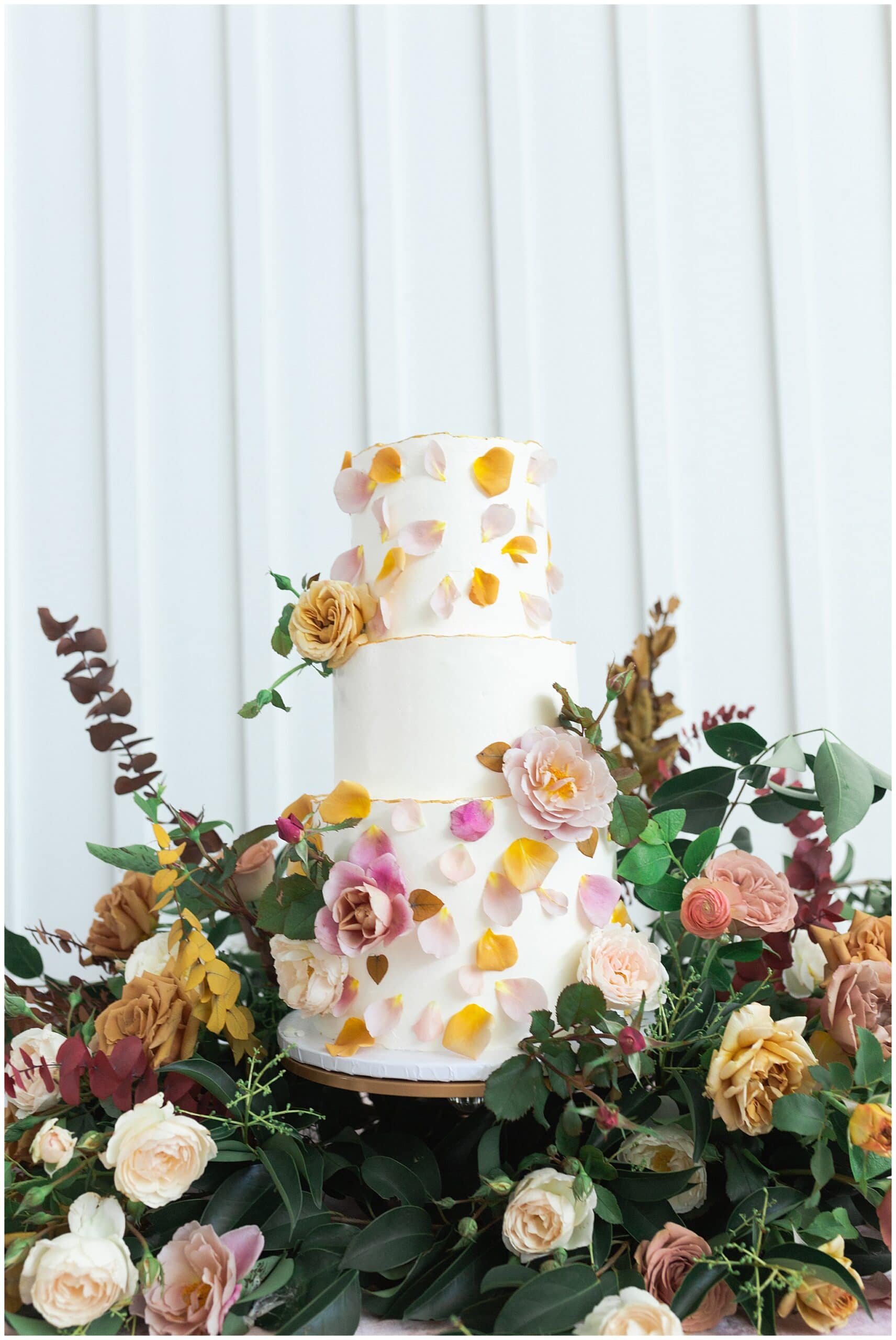 wedding cake blush and yellow tones at The Farmhouse in Montgomery TX captured by Swish and Click Photography