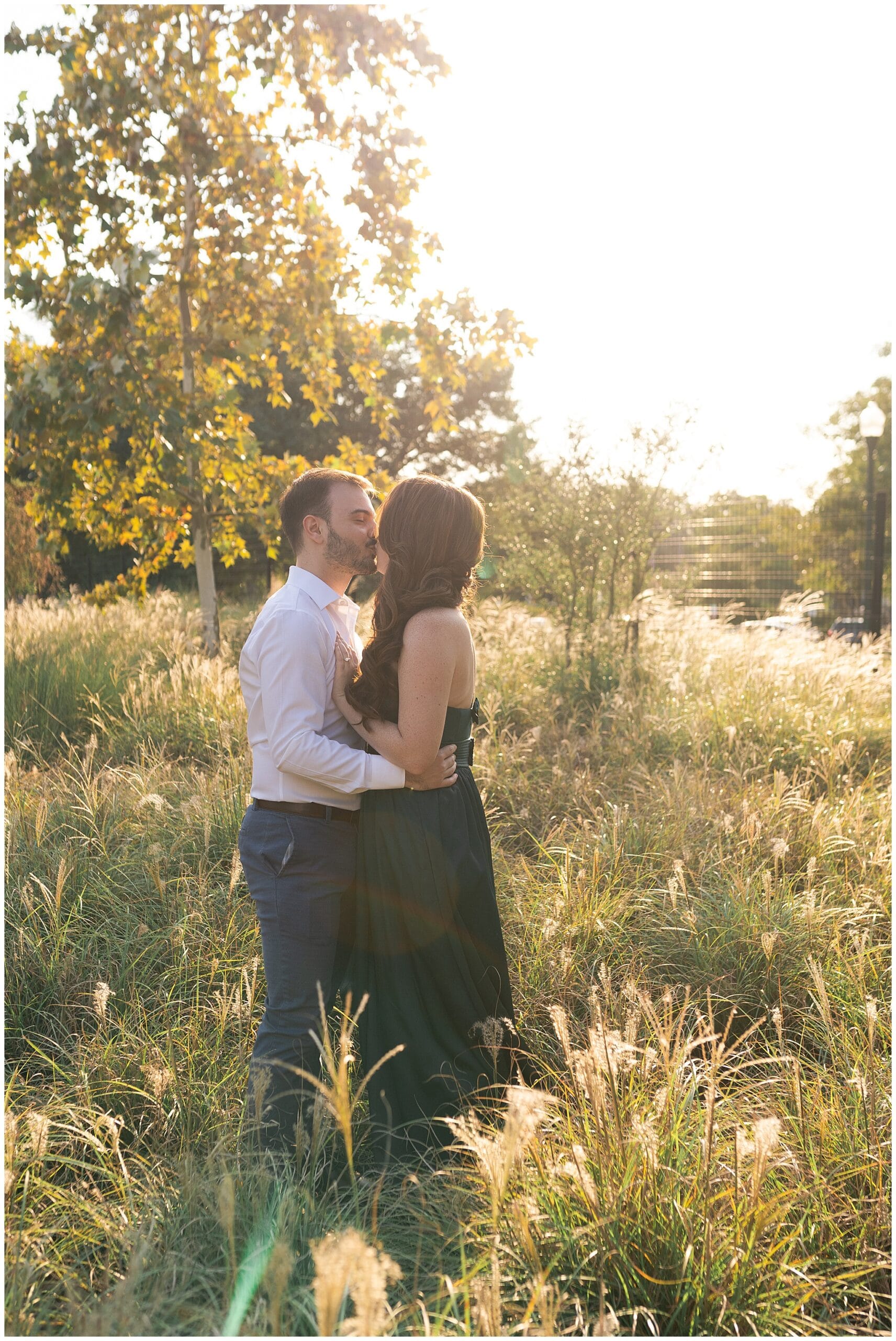 engaged couple kiss during their engagement session at McGovern Centennial Gardens in Houston Texas captured by Swish and Click Photography