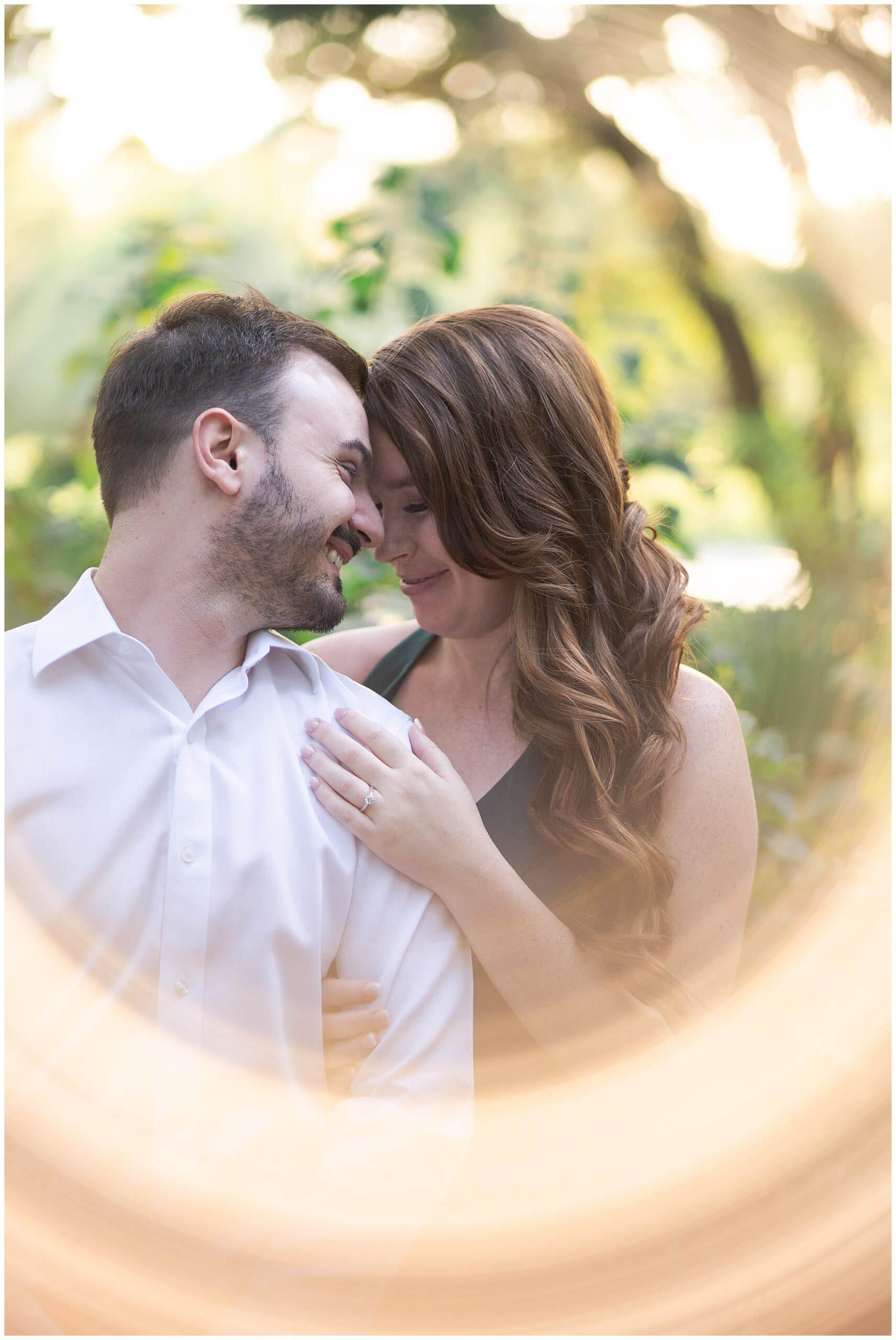 Houston engagement session at McGovern Centennial Gardens captured by Swish and Click Photography with a couple that's cuddling