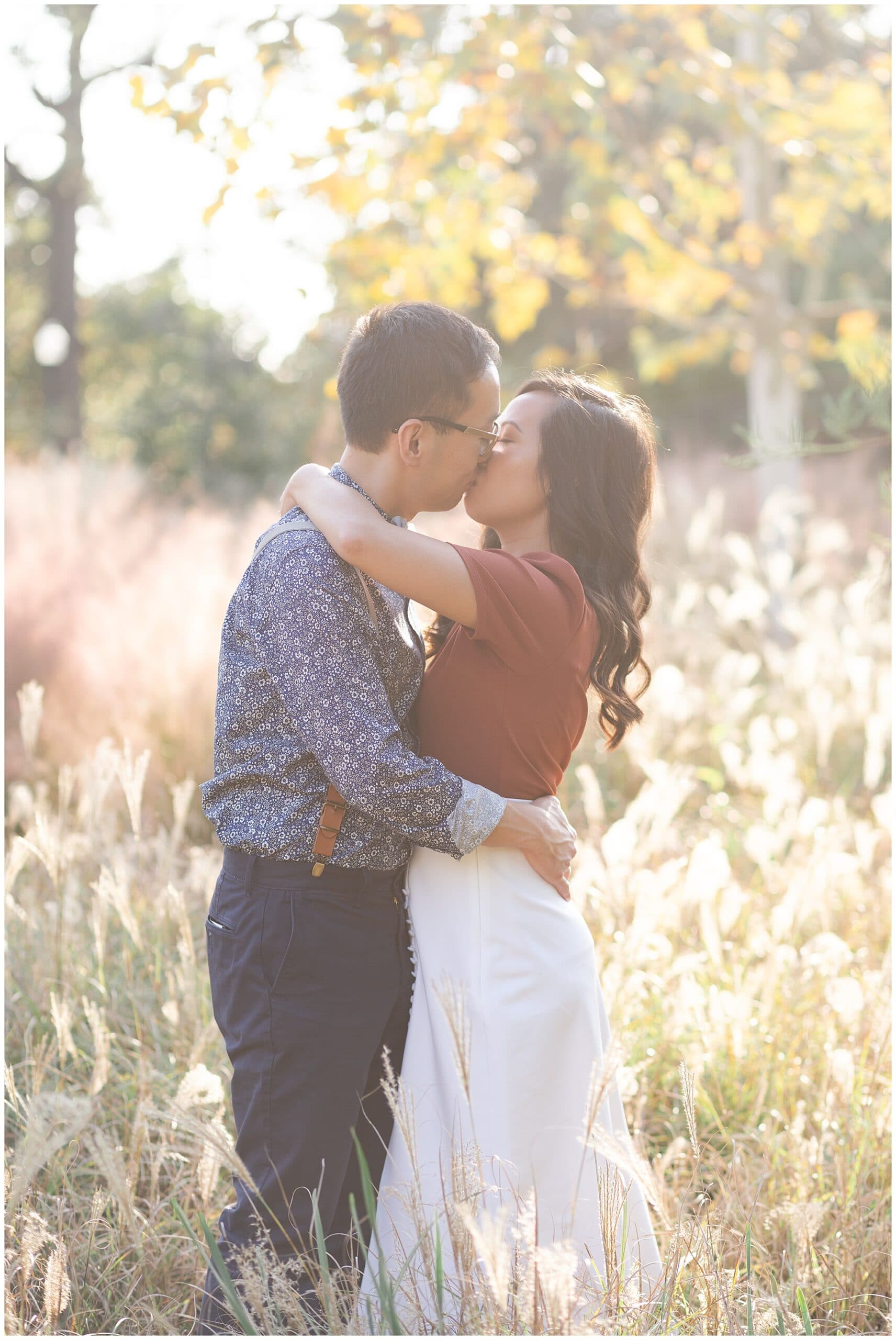 engaged couple kisses during Houston engagement session at McGovern Centennial Gardens by Swish and Click Photography