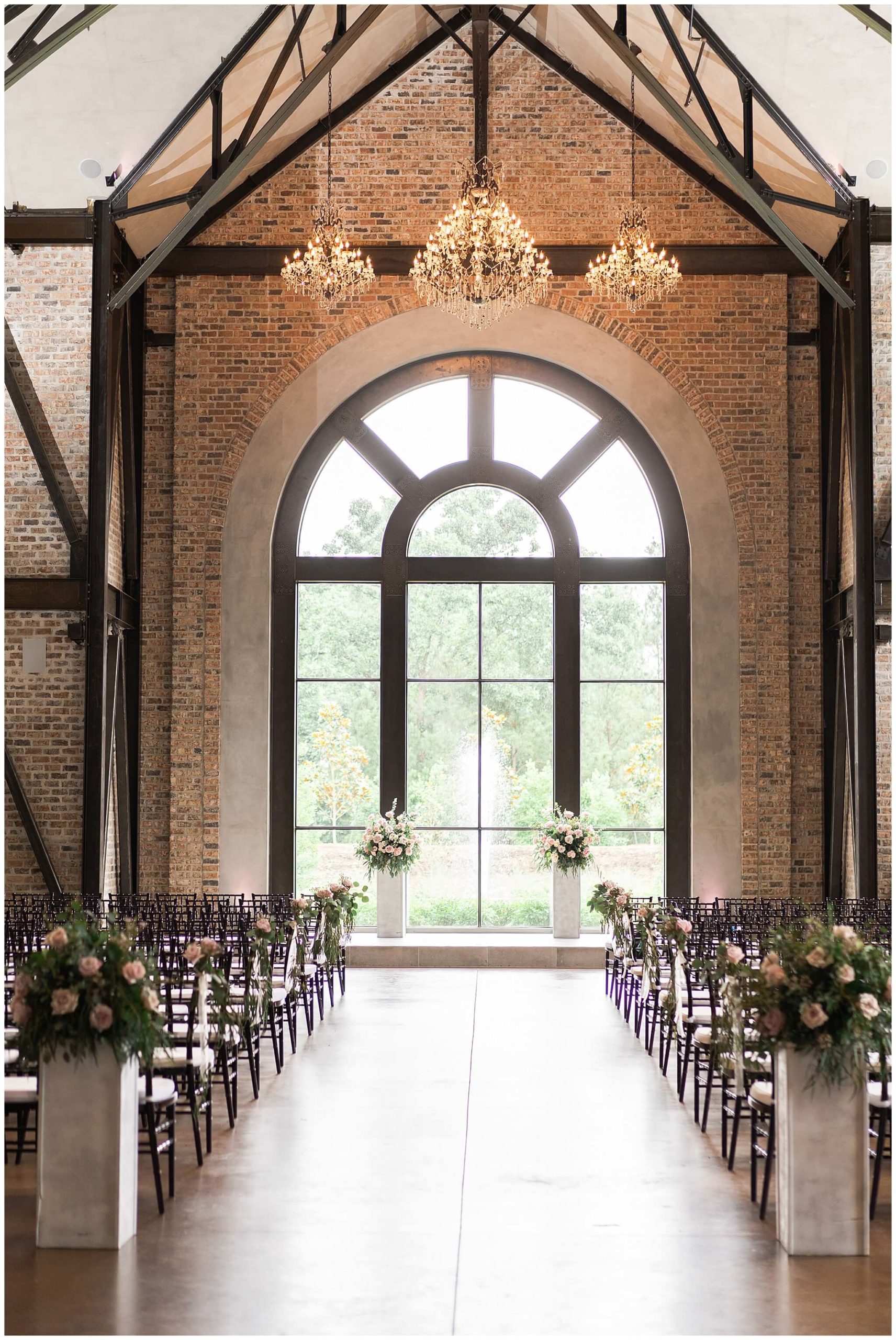flowers adorn the ceremony space  at Iron Manor in Houston Texas by Swish and Click Photography