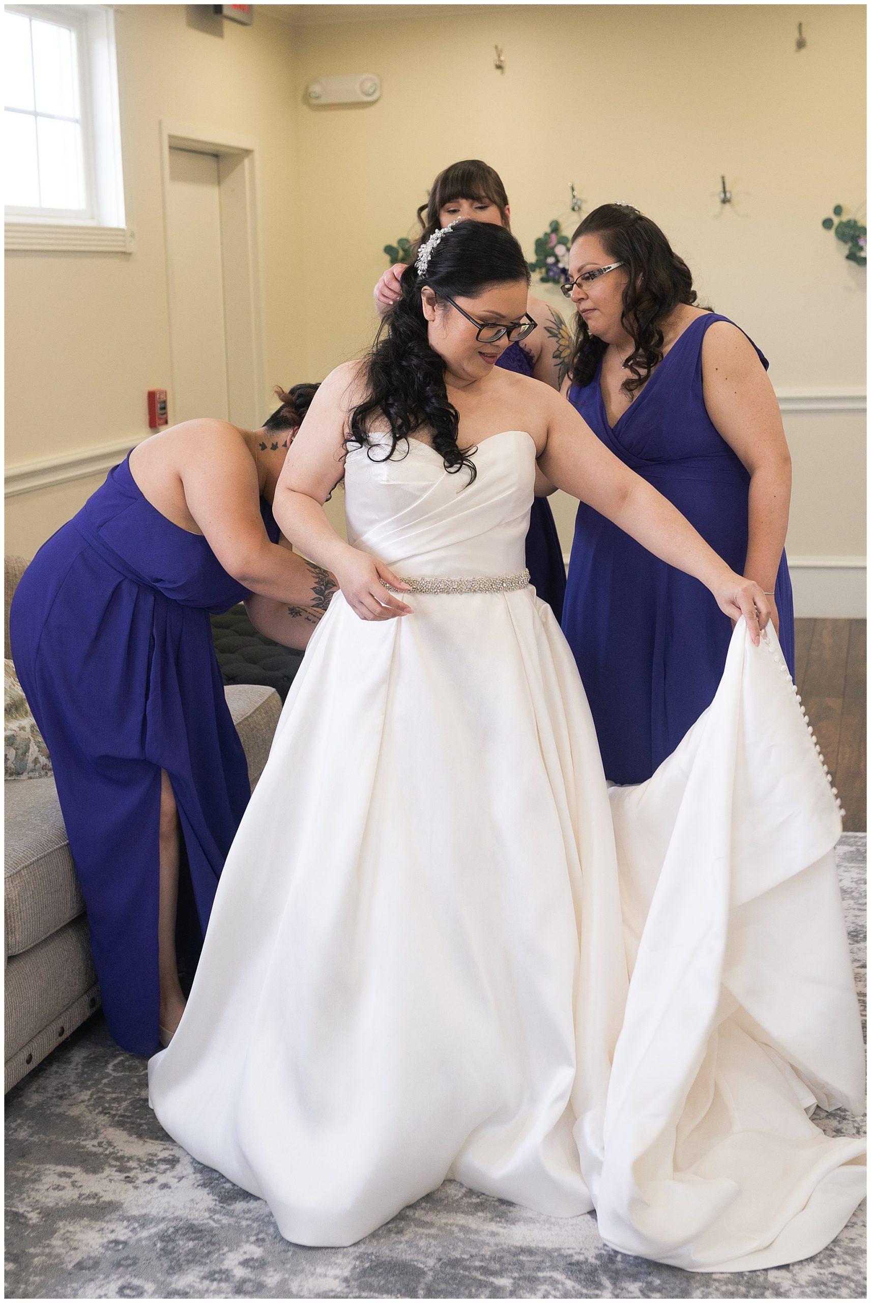 bride put in wedding gown at Ashton Gardens in Houston Texas by Swish and Click Photography