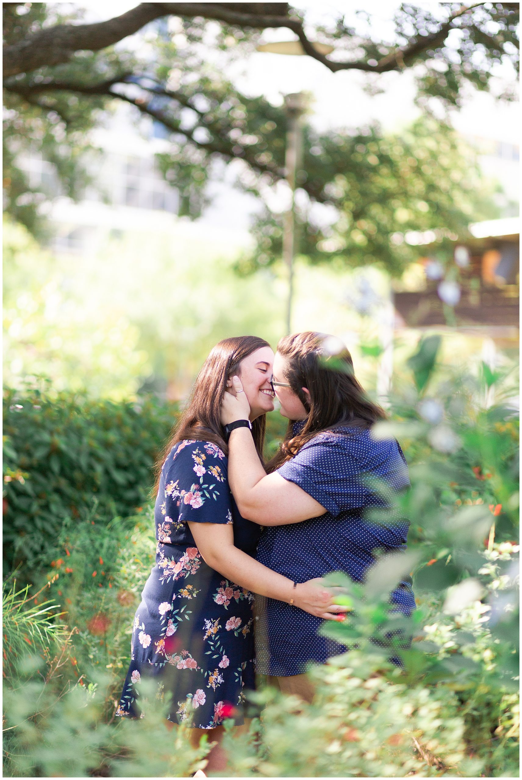 engaged couple laugh together at Discovery Green engagement session in Houston Texas by Swish and Click Photography
