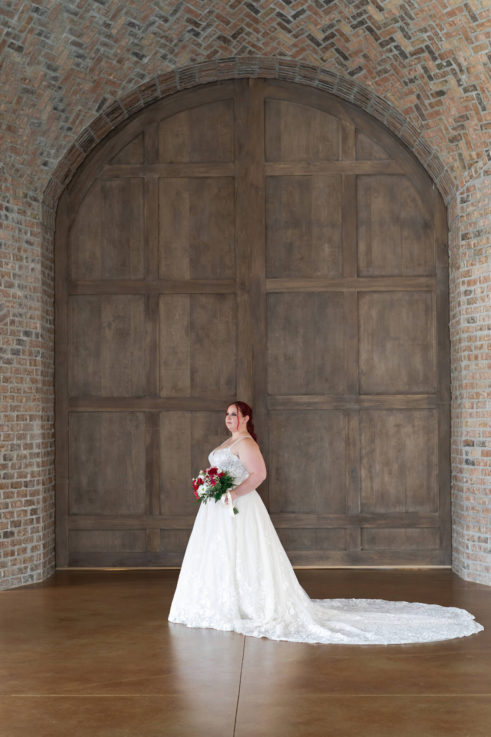 bride poses during her bridal session at Iron Manor in Houston Texas by Swish and Click Photography