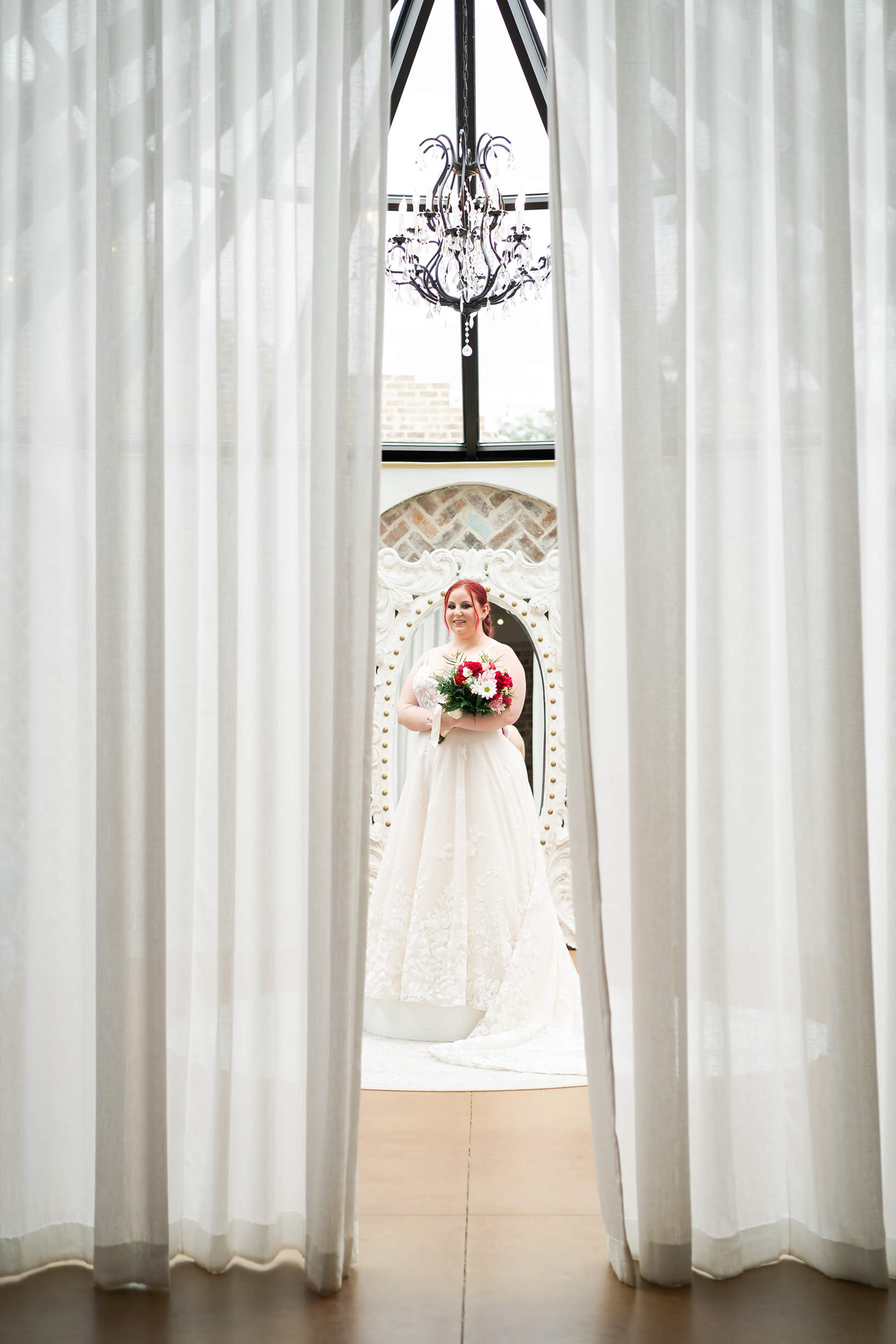 bride smiles on her wedding day reception space at Iron Manor in Houston Texas by Swish and Click Photography