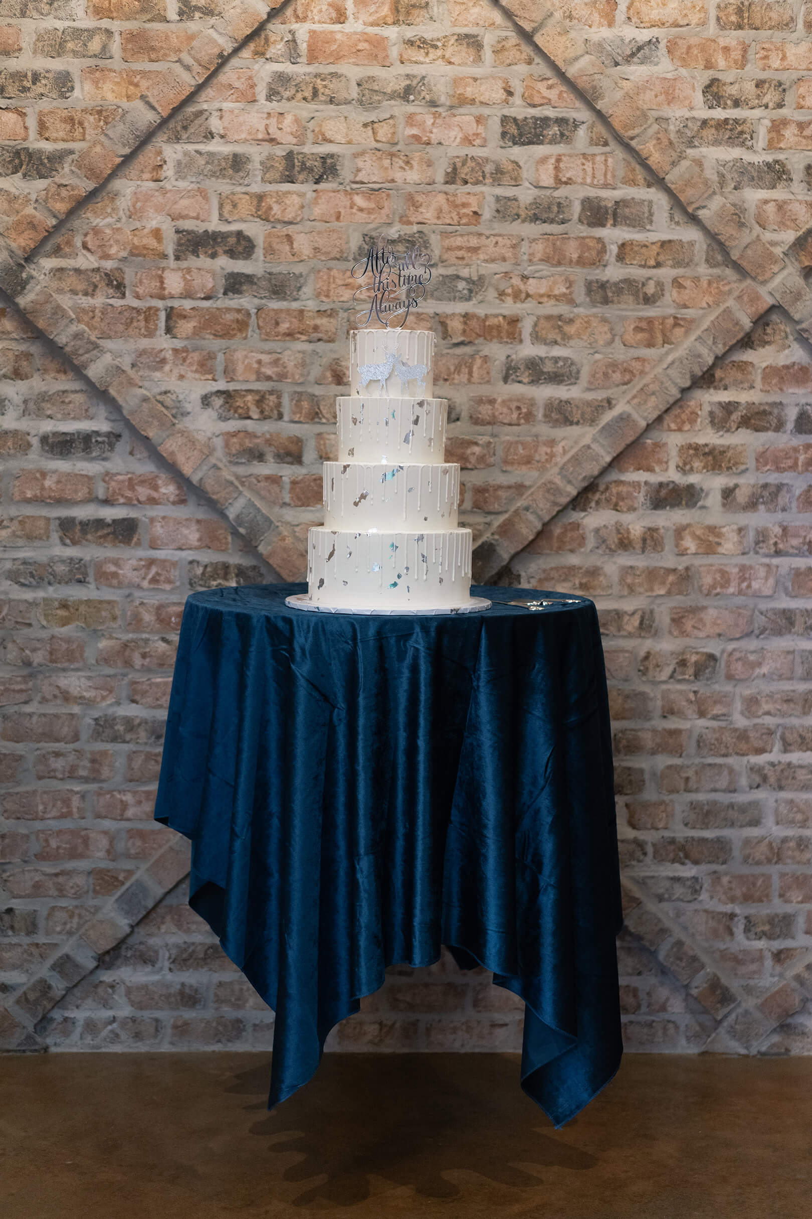 floating cake on cake stand reception space in Crane Hall at Iron Manor in Houston Texas by Swish and Click Photography