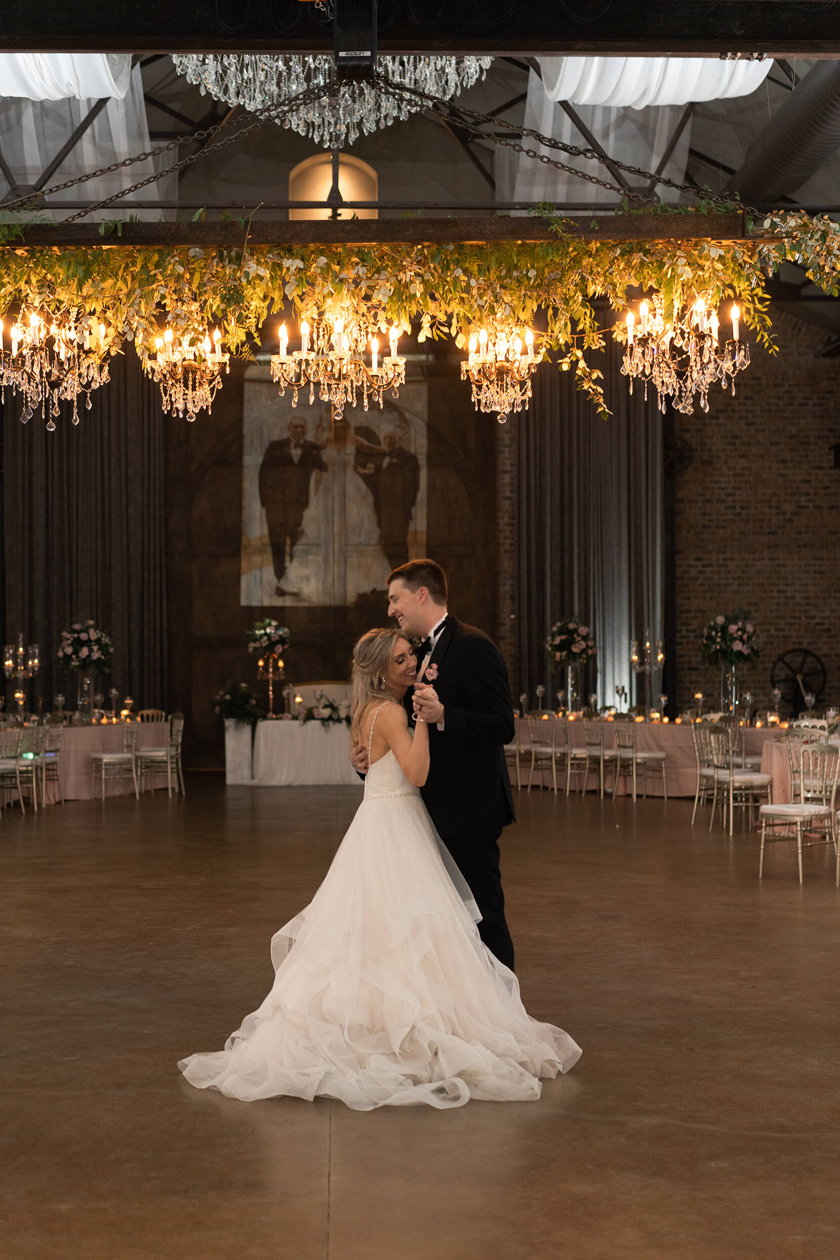 bride and groom dance on their wedding day reception space in Crane Hall at Iron Manor in Houston Texas by Swish and Click Photography