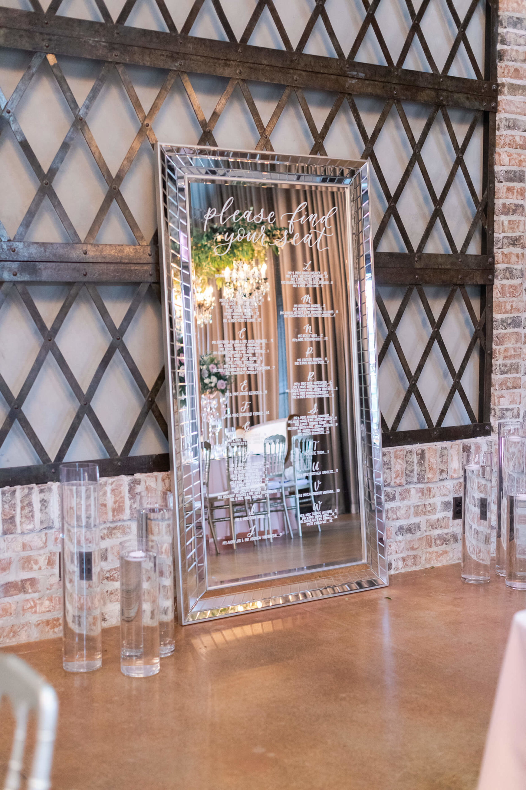 mirror with calligraphy in the reception space in Crane Hall at Iron Manor in Houston Texas by Swish and Click Photography