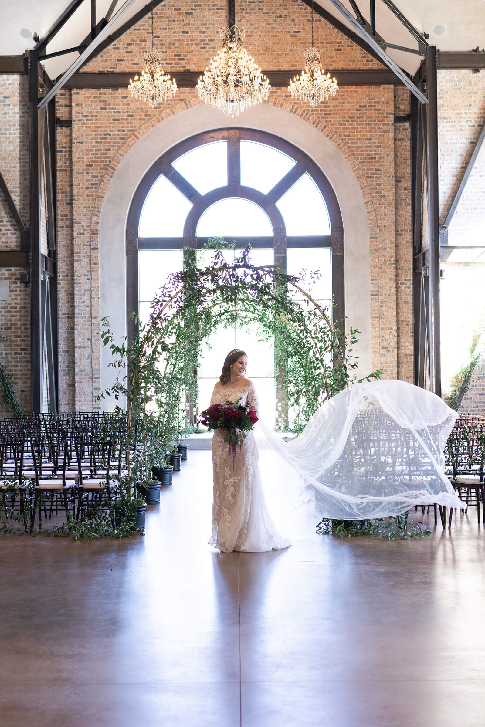 bride smiles in the chapel during her bridal session at Iron Manor in Houston Texas by Swish and Click Photography
