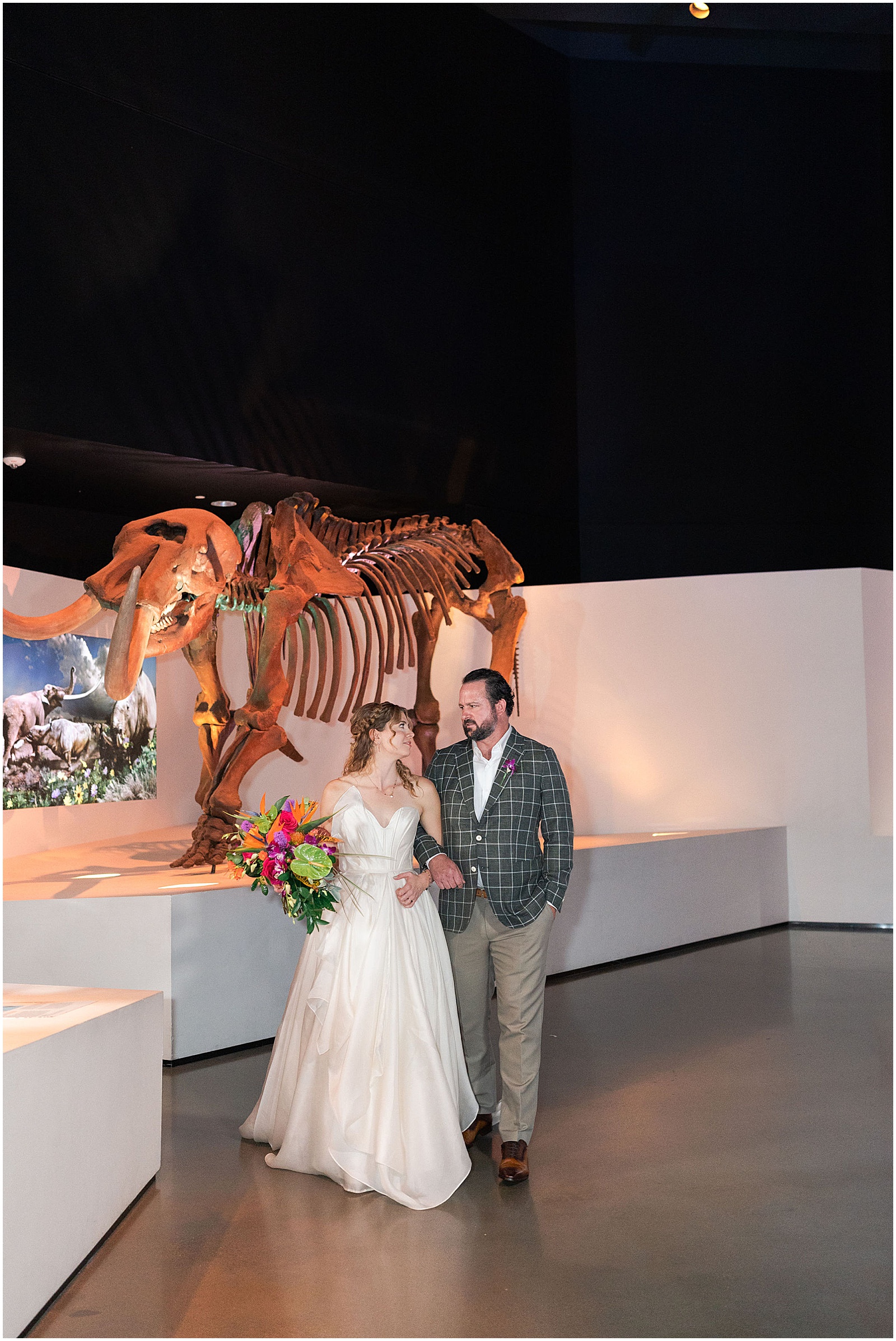 Bride and Groom portraits with Dinosaurs at The Houston Museum of Natural Science | Swish and Click Photography - Houston Wedding Photographer