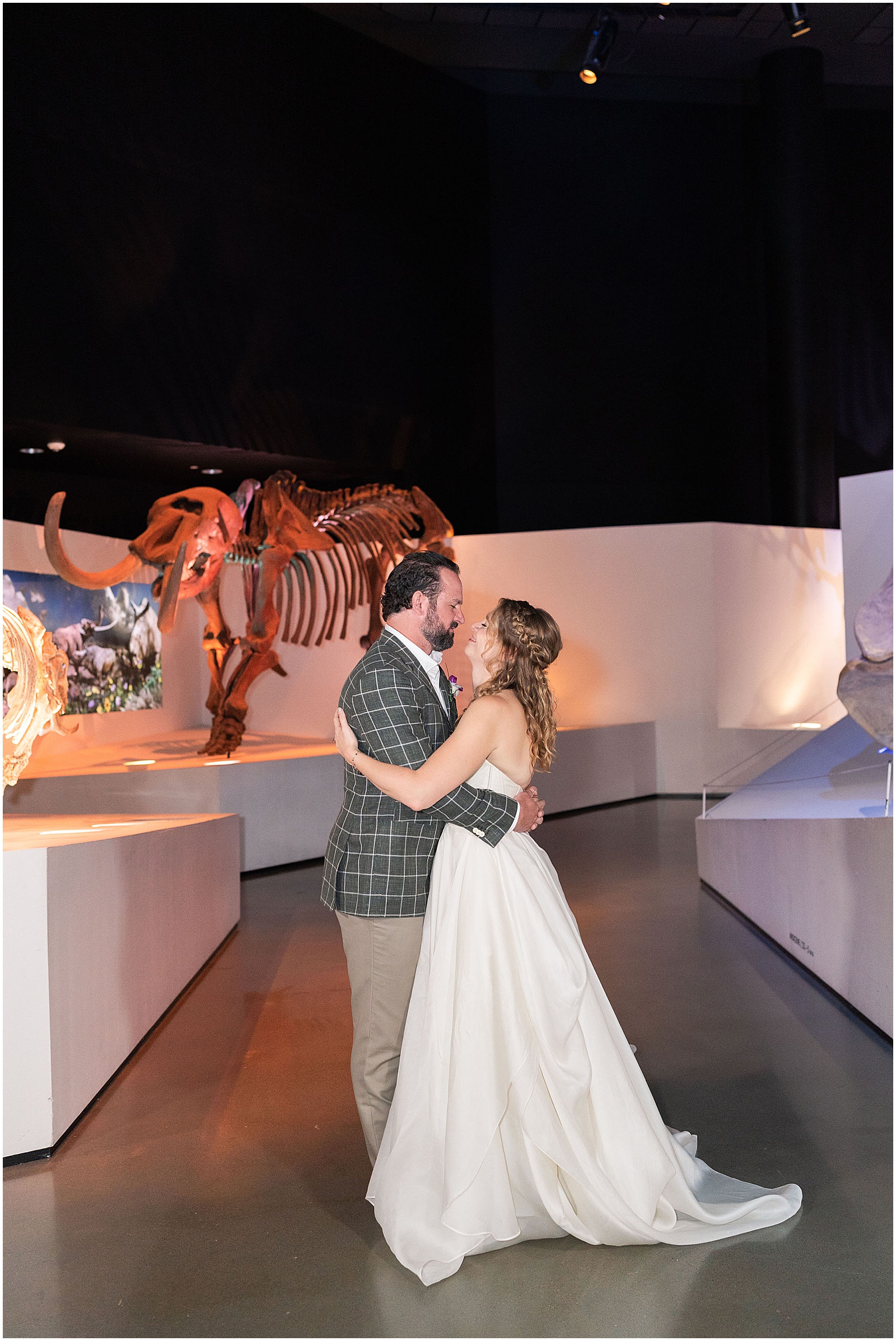 Bride and Groom photos with Dinosaurs at The Houston Museum of Natural Science | Swish and Click Photography - Houston Wedding Photographer
