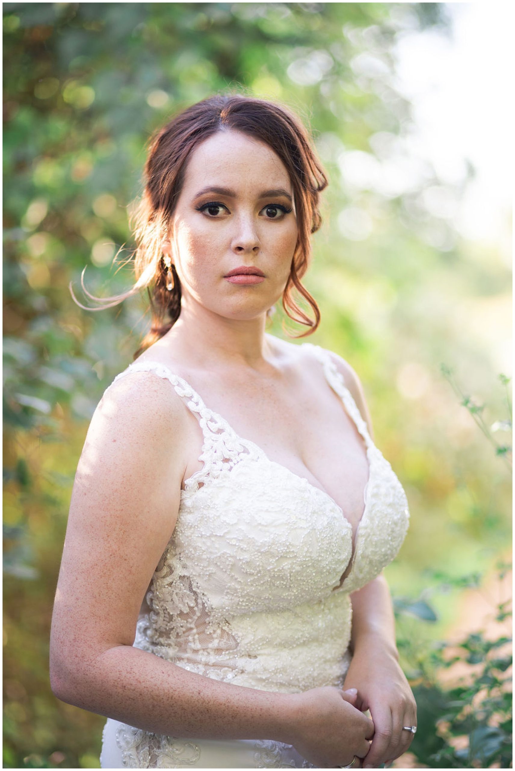 bride looks at her photographer at Barr Mansion in Austin Texas by Swish and Click Photography