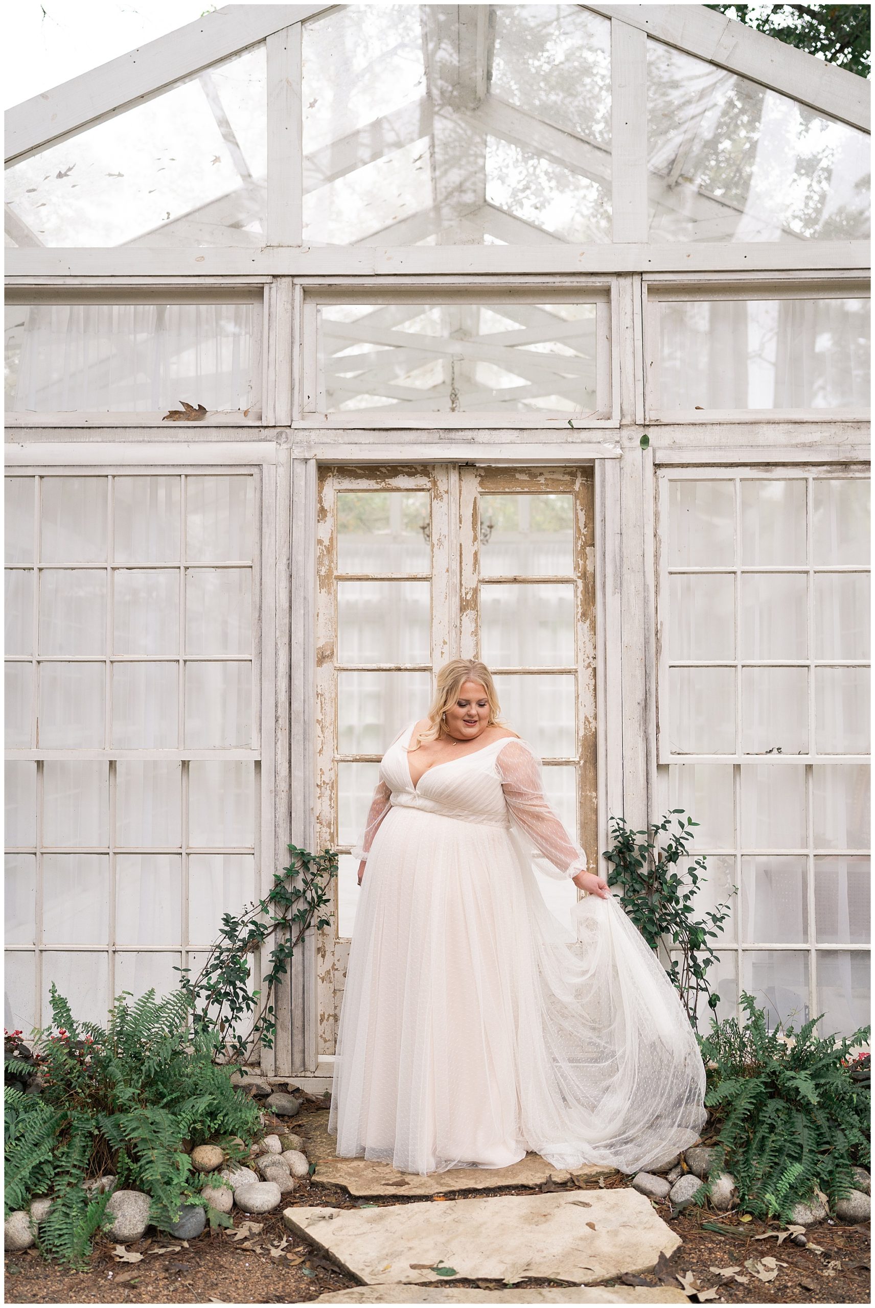 bride swooshes her wedding gown in her bridal portraits at the Oak Atelier captured by Swish and Click Photography