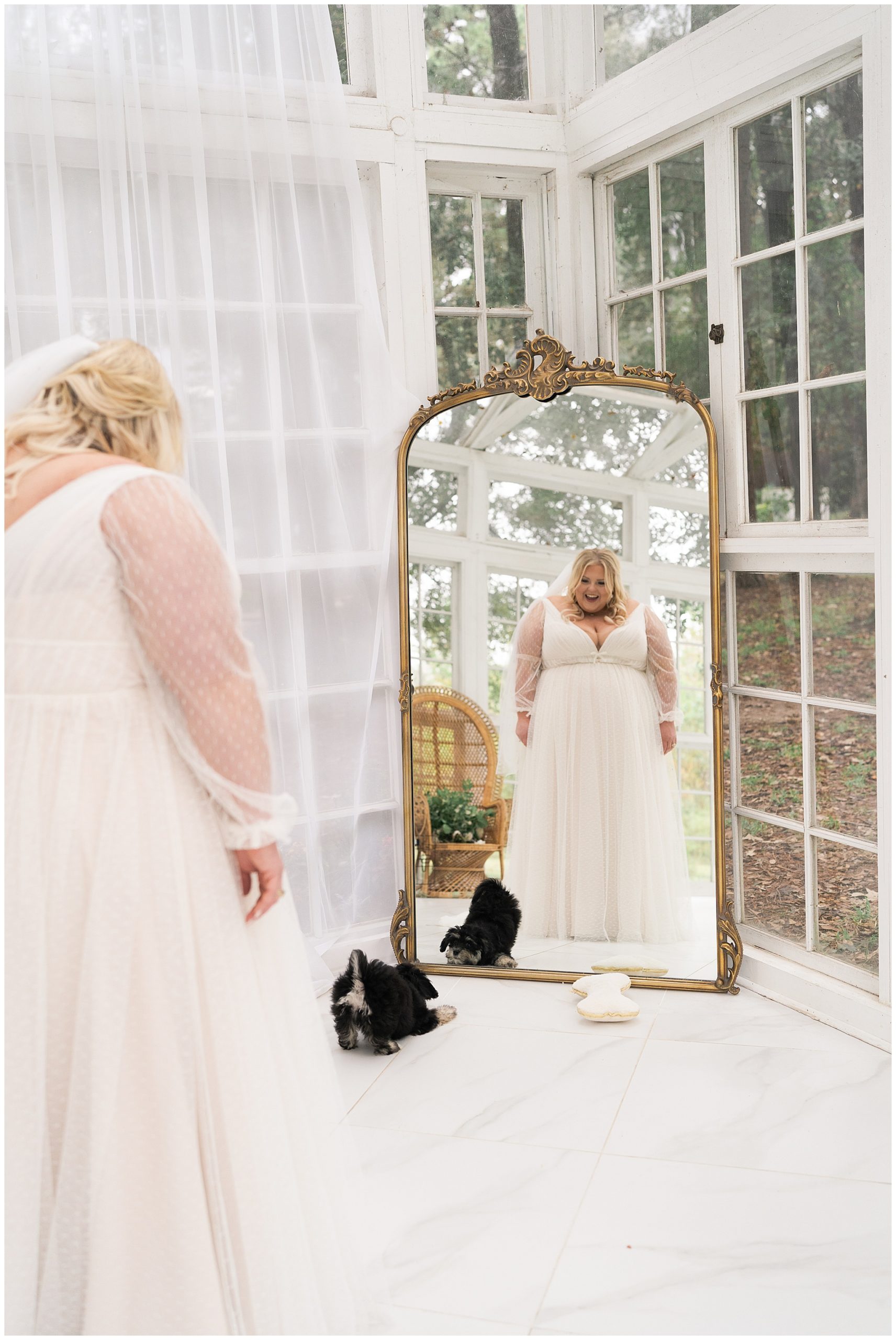 bride laughs at her puppy Waffles during her bridal portraits at the Oak Atelier captured by Swish and Click Photography