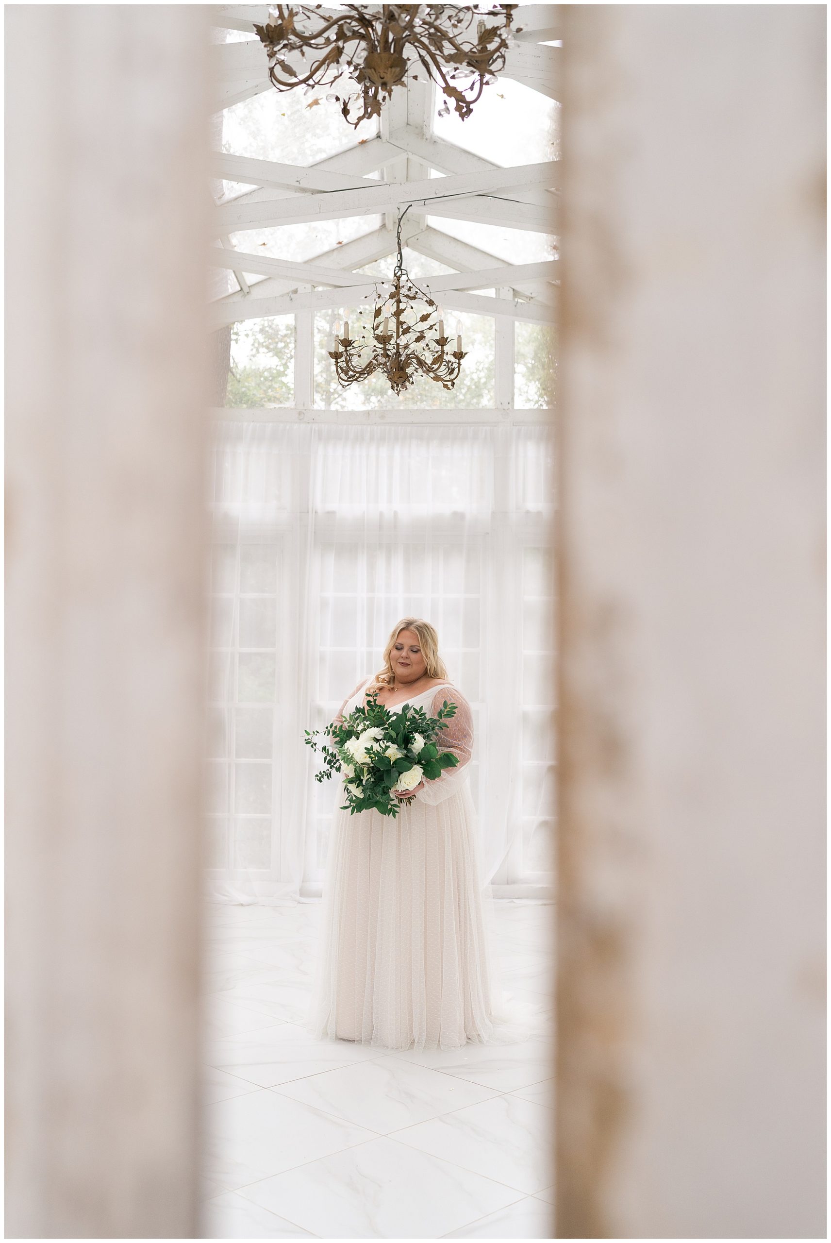 bride poses in her wedding gown at the Oak Atelier in Houston by Swish and Click Photography