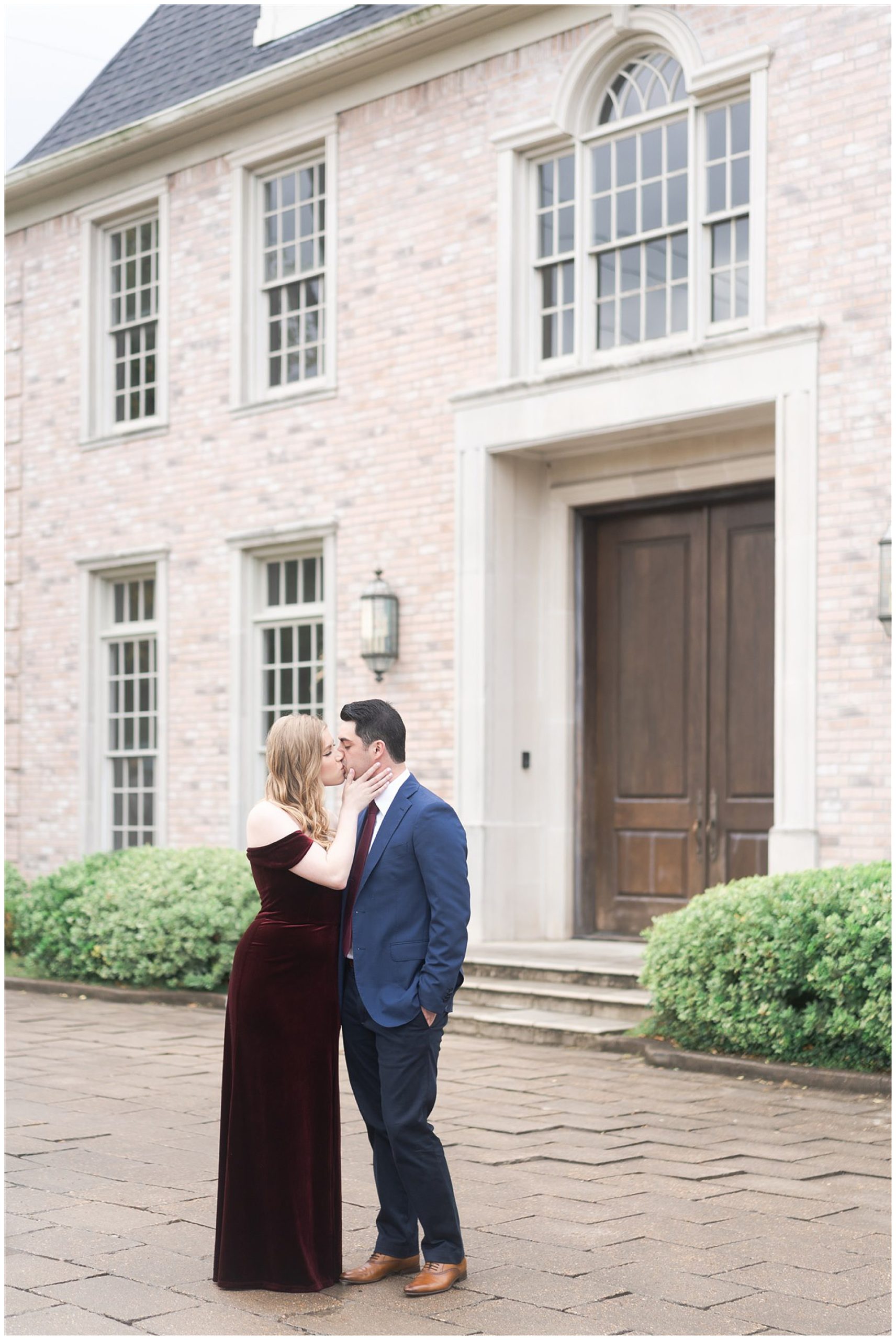 couple kisses during their engagement session at the Creative Chateau in Houston by Swish and Click Photography