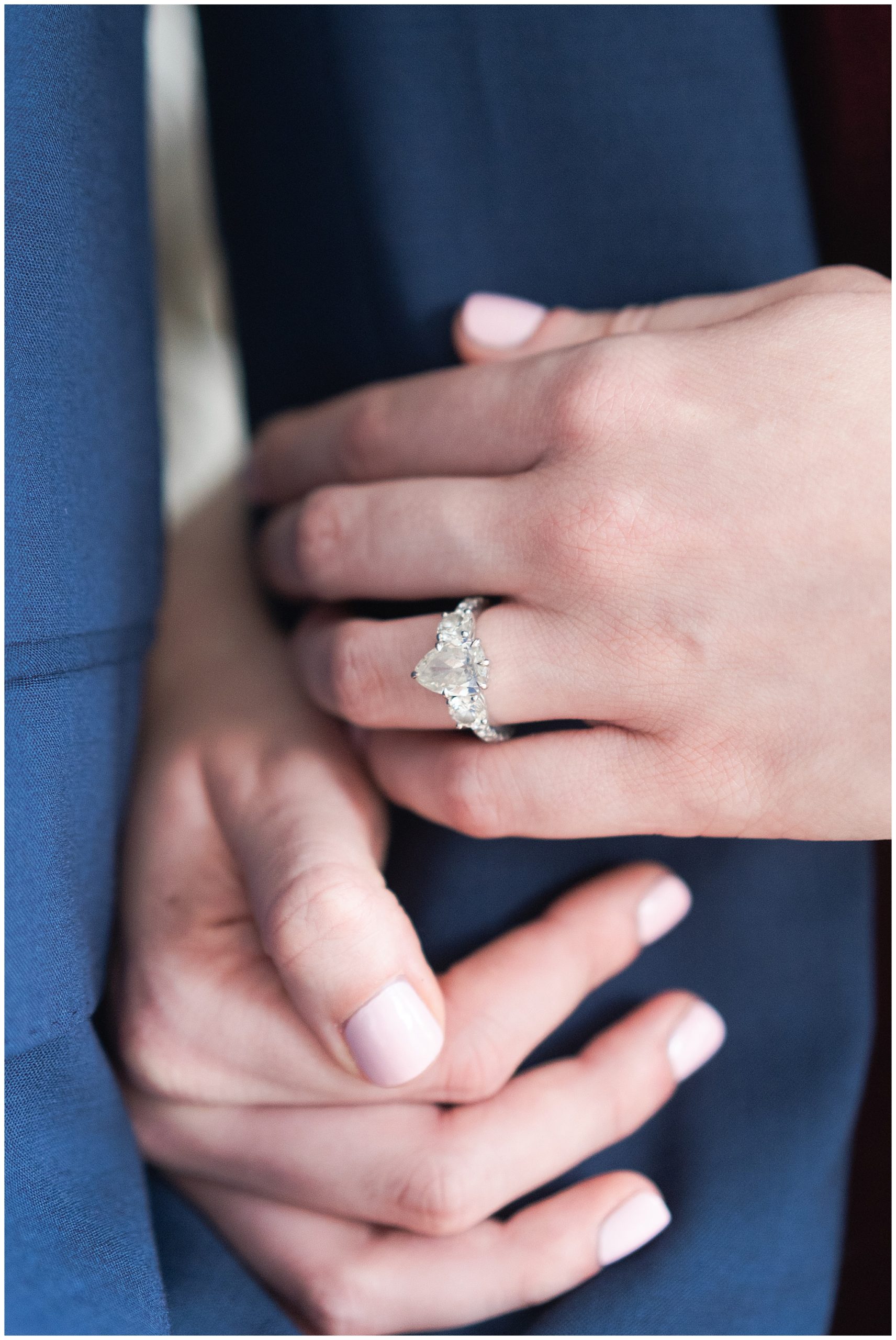 bride shows off her engagement ring during their engagement session at the Creative Chateau in Houston by Swish and Click Photography