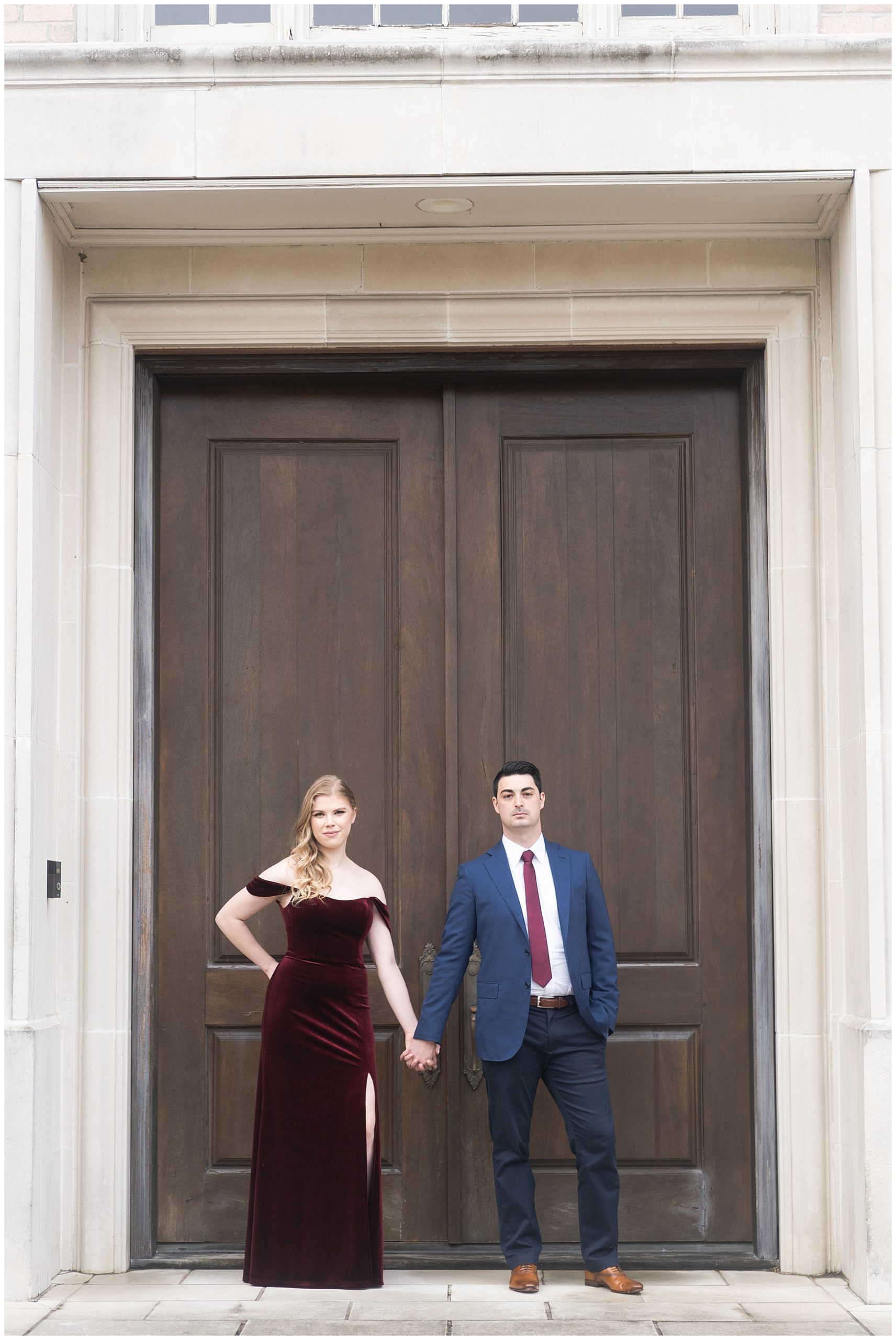 couple pose in front of a brown door during their engagement session at the Creative Chateau in Houston by Swish and Click Photography