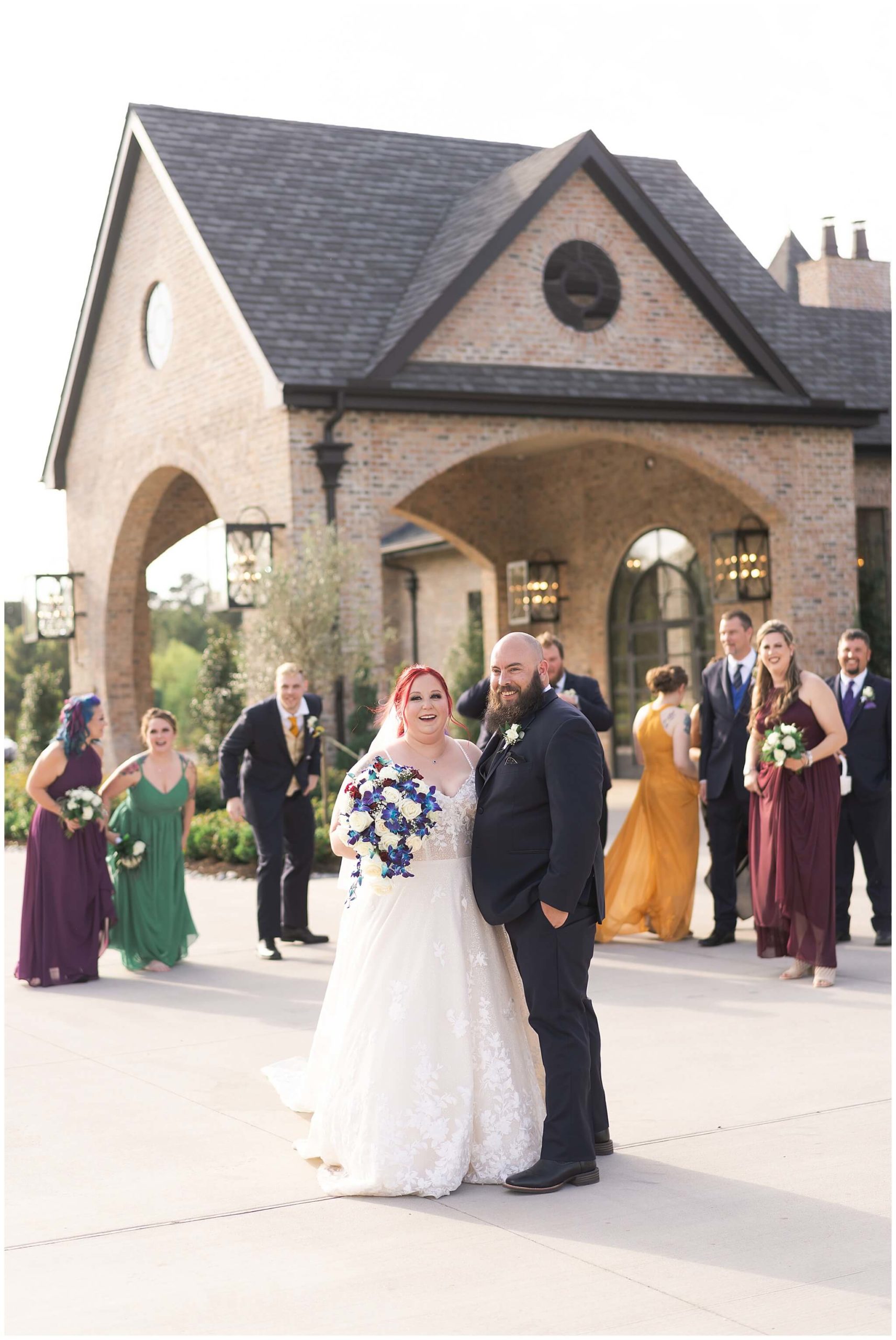 wedding party walks with the bride and groom on their wedding day at Iron Manor in Houston Texas by Swish and Click Photography