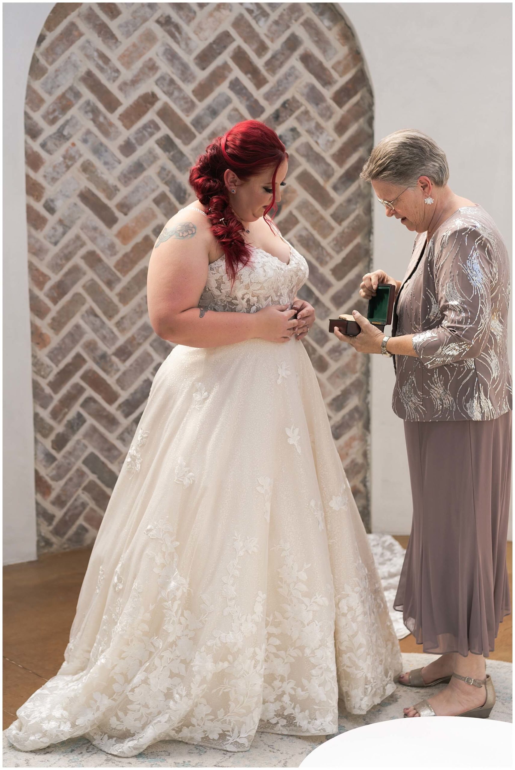 mom gives daughter a special gift on her wedding day at Iron Manor in Houston Texas by Swish and Click Photography