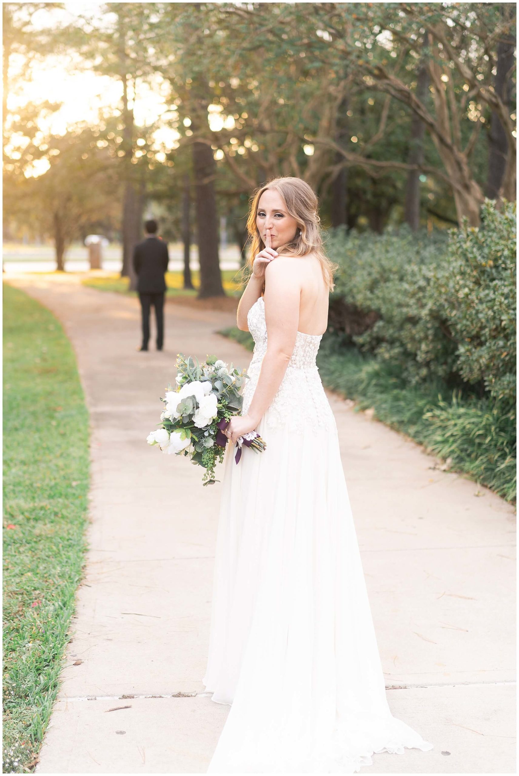 bride just before her wedding day first look at Mecom Rockwell Colonnade by Houston wedding photographer Swish and Click Photography