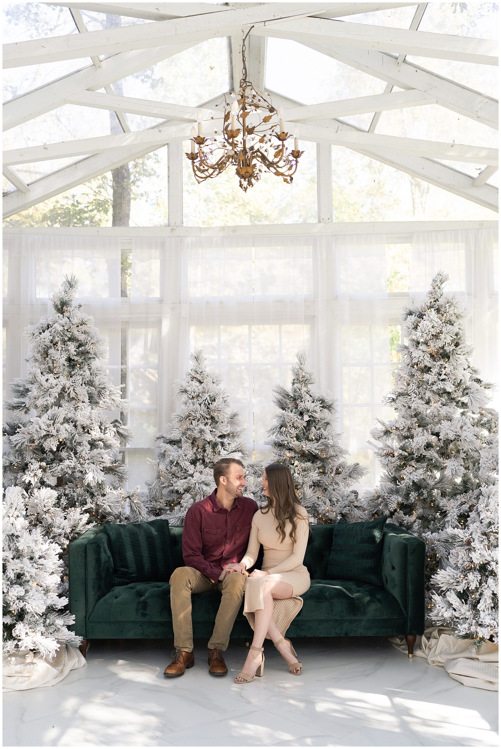 couple poses for Christmas photos at the Oak Atelier in Houston Texas by photographer Swish and Click Photography