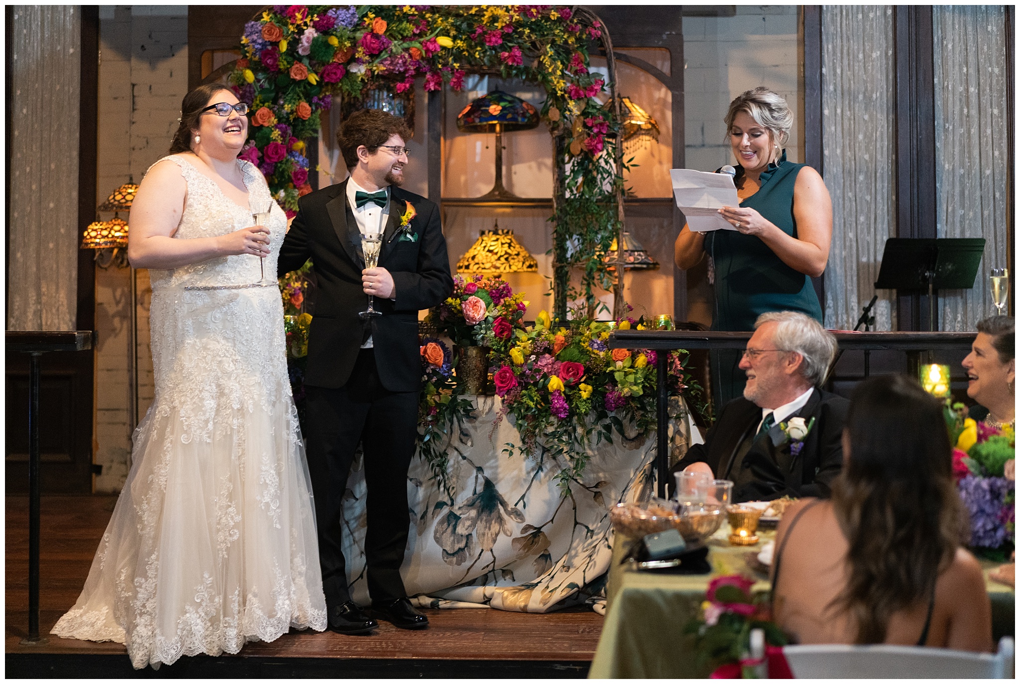 wedding toasts at nouveau art by Houston wedding photographer Swish and Click Photography
