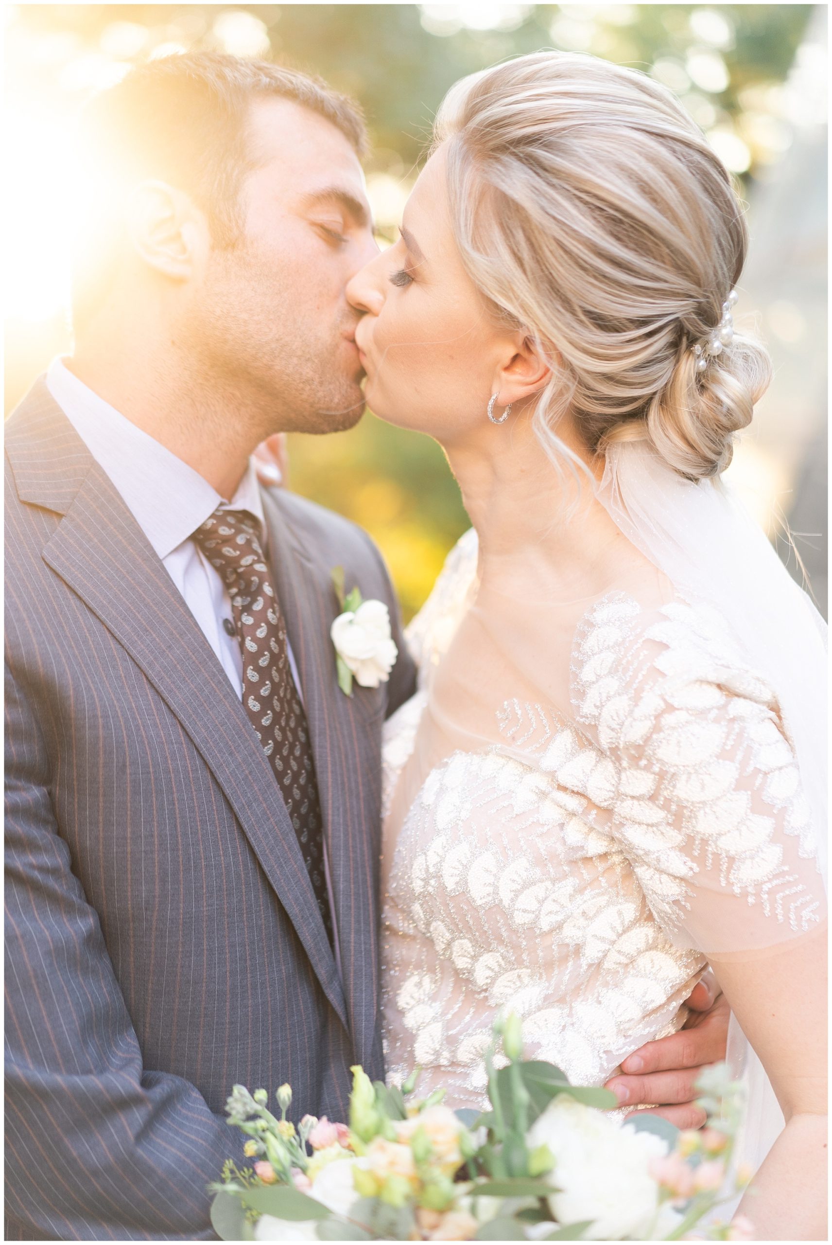 bride and groom kiss on their wedding day at the Museum of Natural Science by Swish and Click Photography