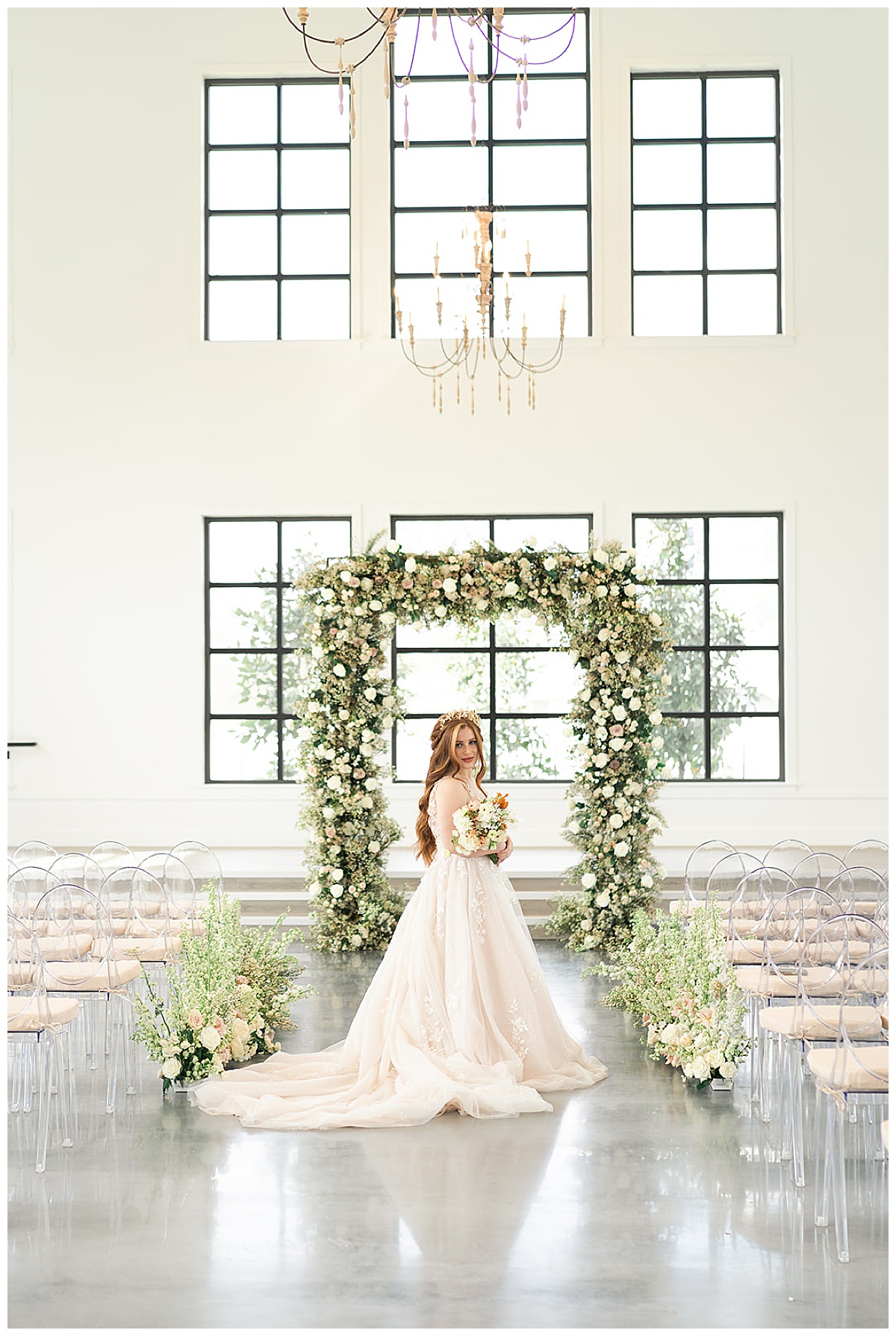 Woman standing under ceremony arch for Swish & Click Photography