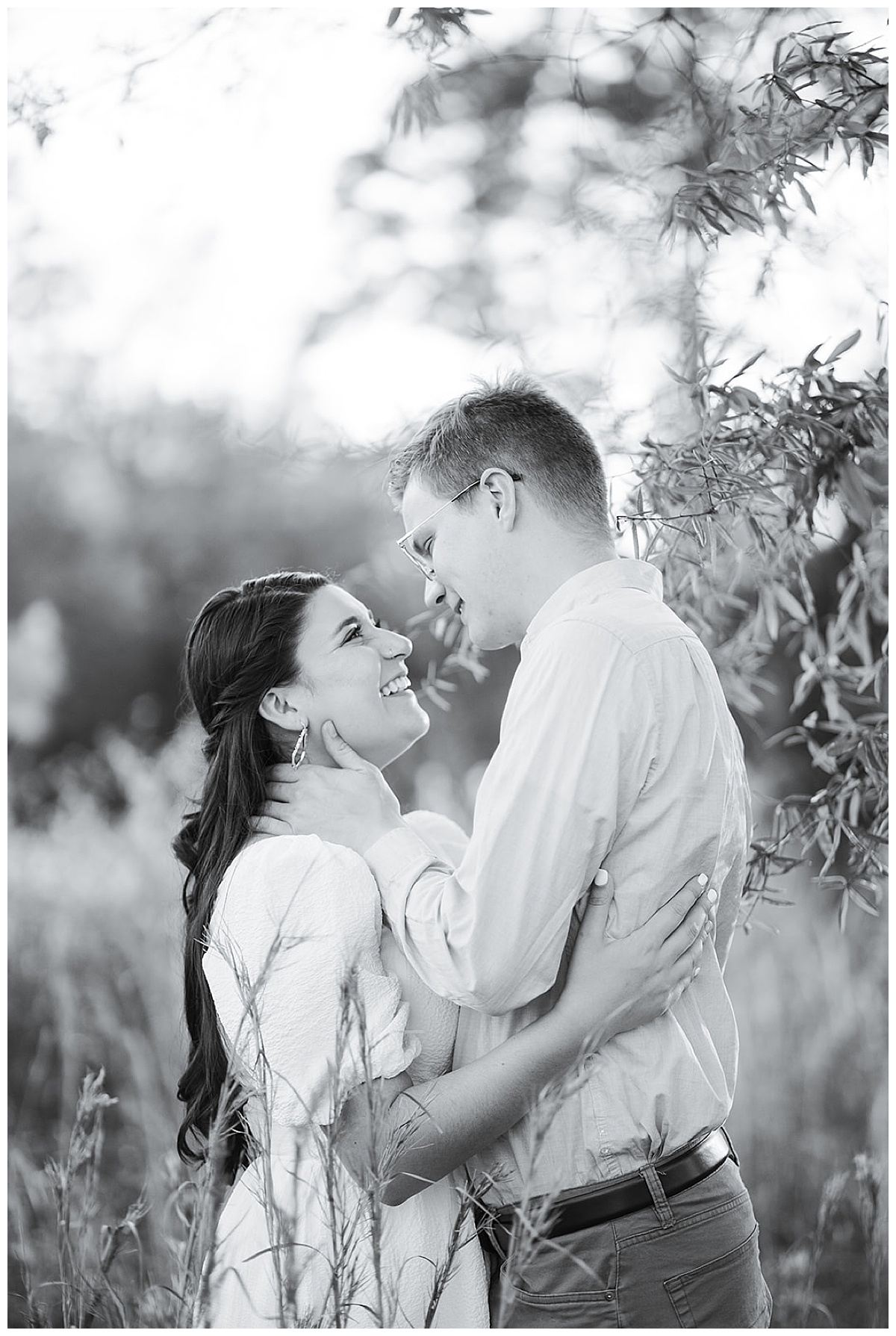 Couple hold one another close for Houston Arboretum Engagement Session