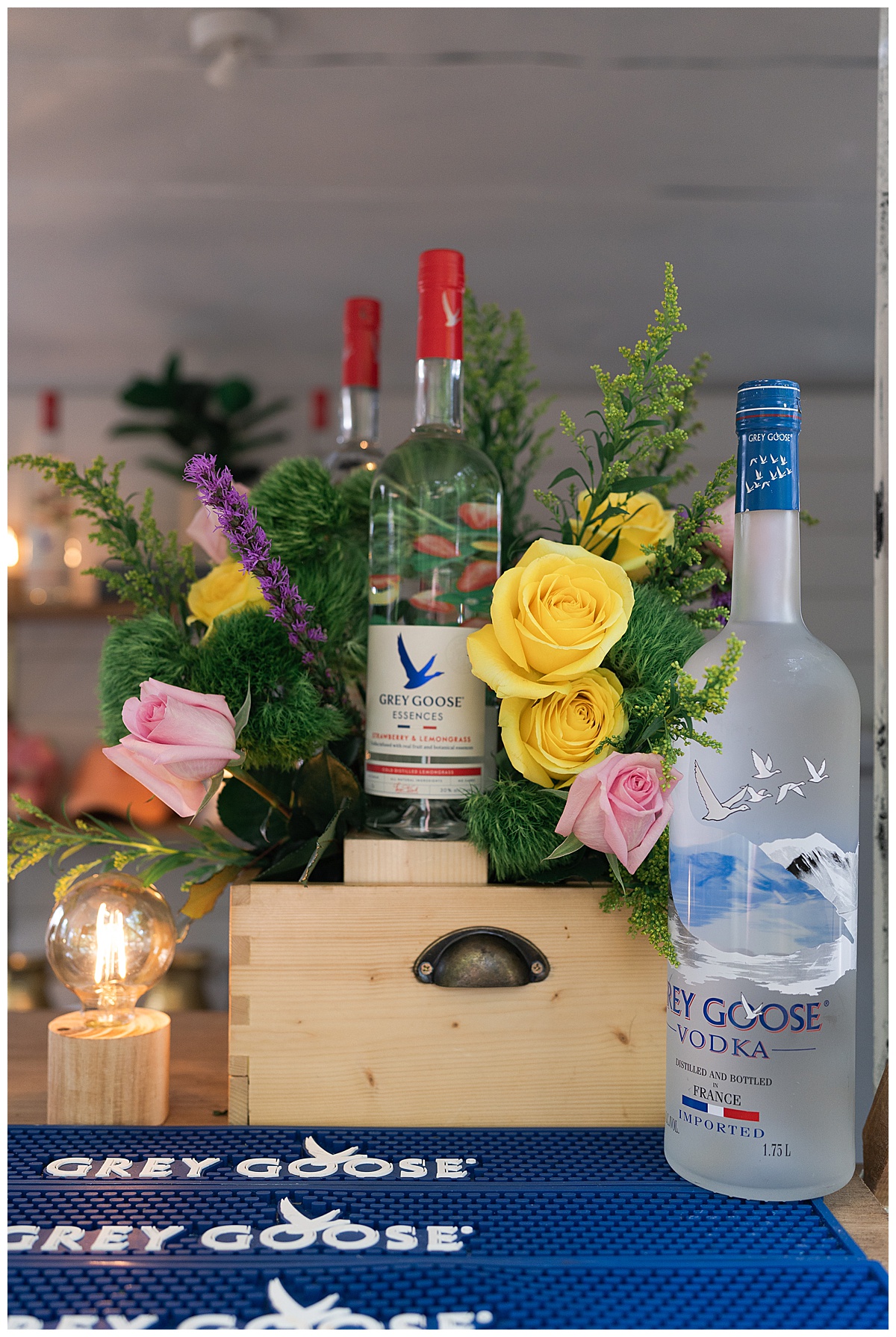 Flowers decorate liquor bottles for the Open House at The Juliana