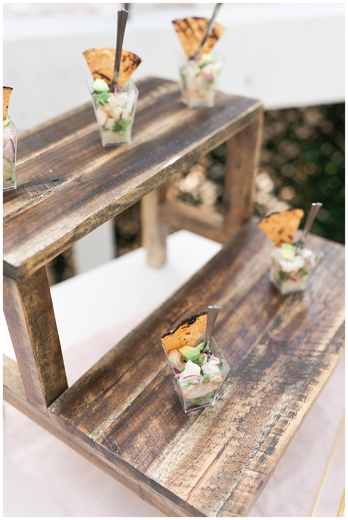 Appetizers displayed on wood stand for the Open House at The Juliana