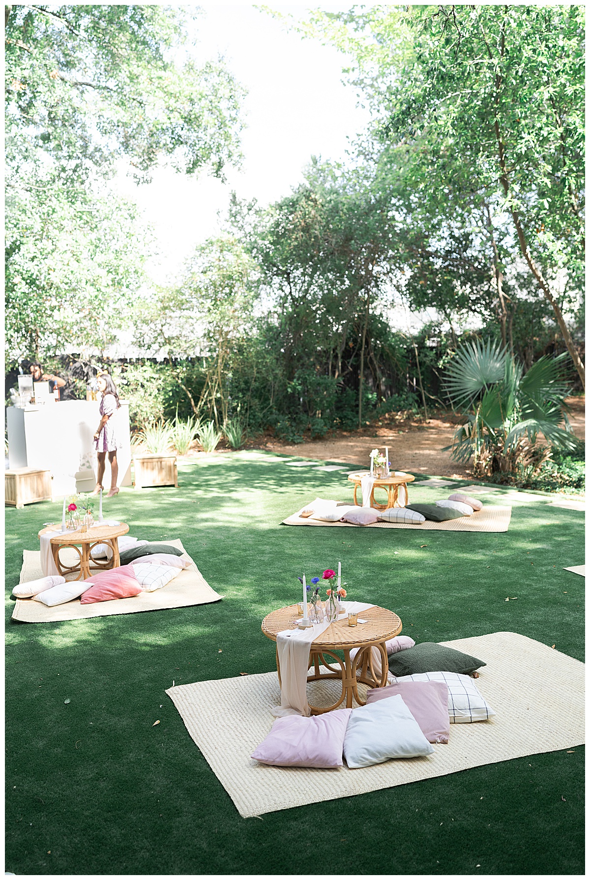 Multiple outdoor picnic setups on the lawn for Swish & Click Photography