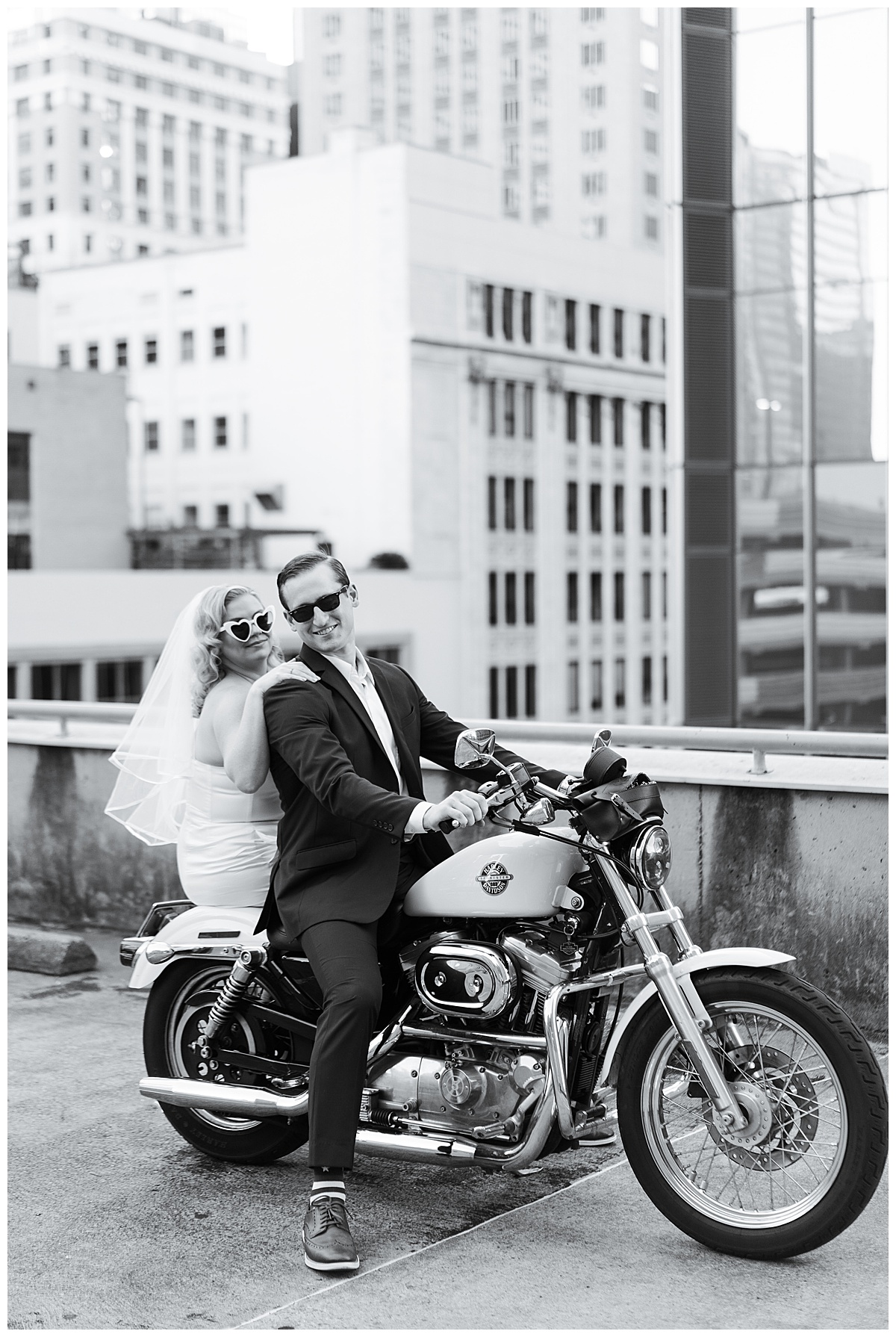 Soon to married couple sit on motorcycle for Swish & Click Photography