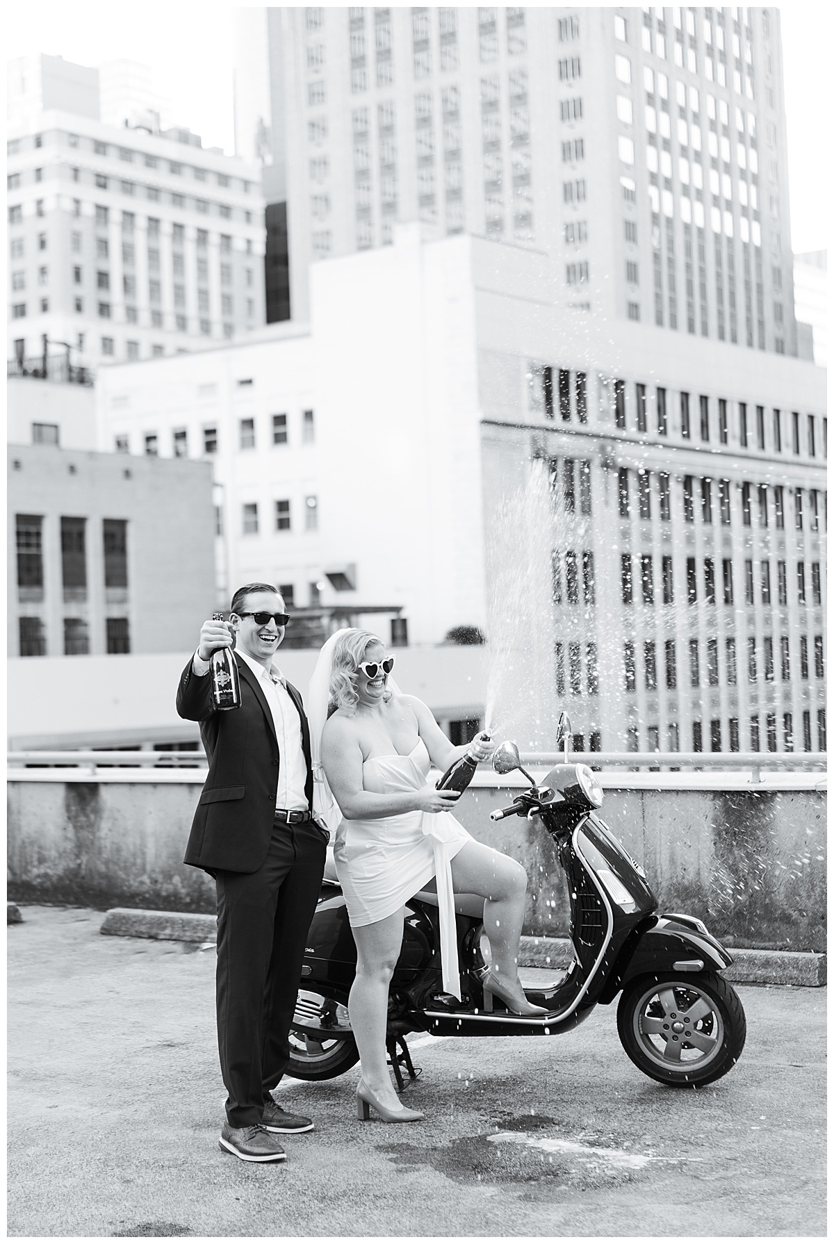 Lady and gentleman sit on Vespa on rooftop for Houston’s Best Wedding Photographers