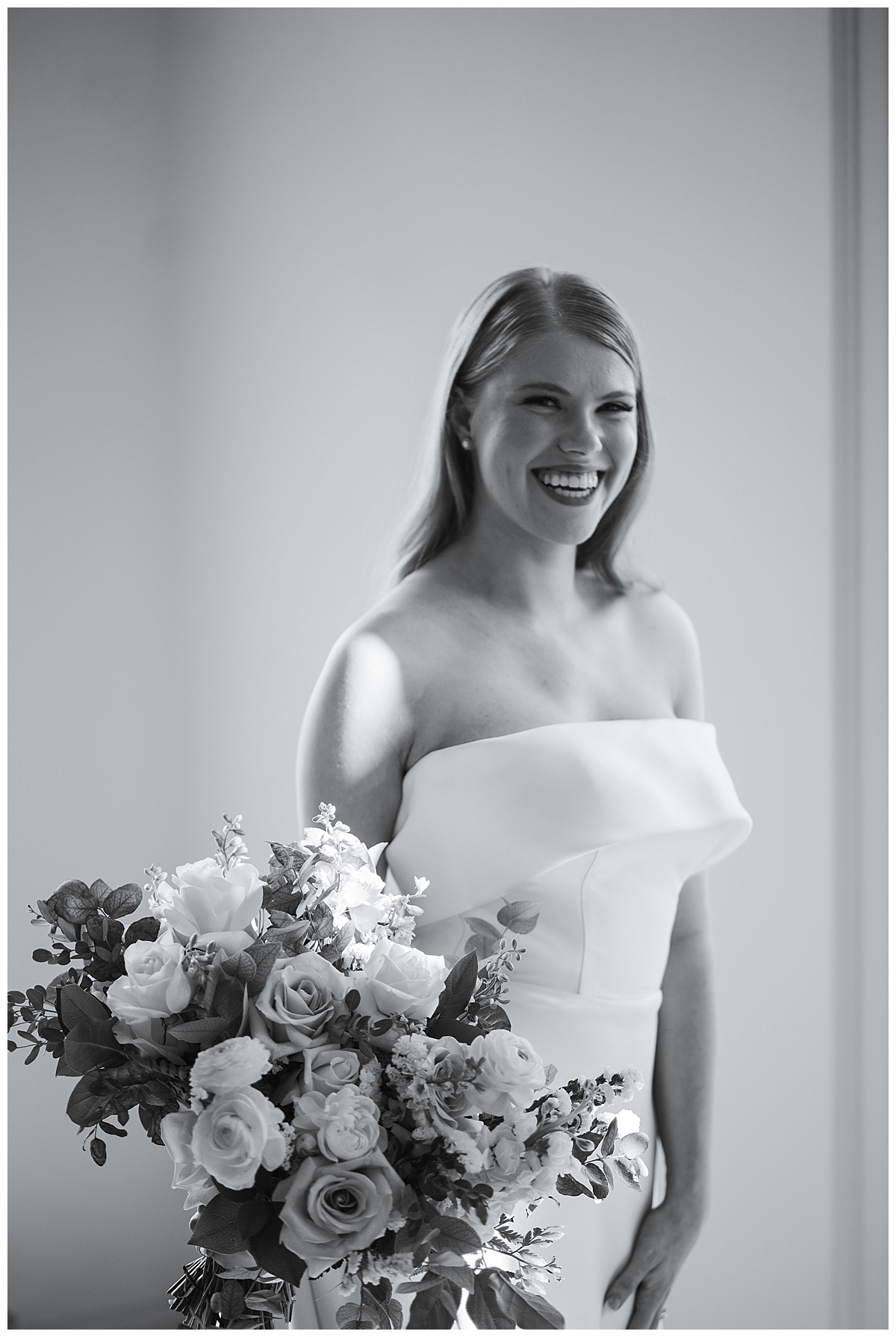 Female smiles and holds bridal bouquet for Houston’s Best Wedding Photographers 