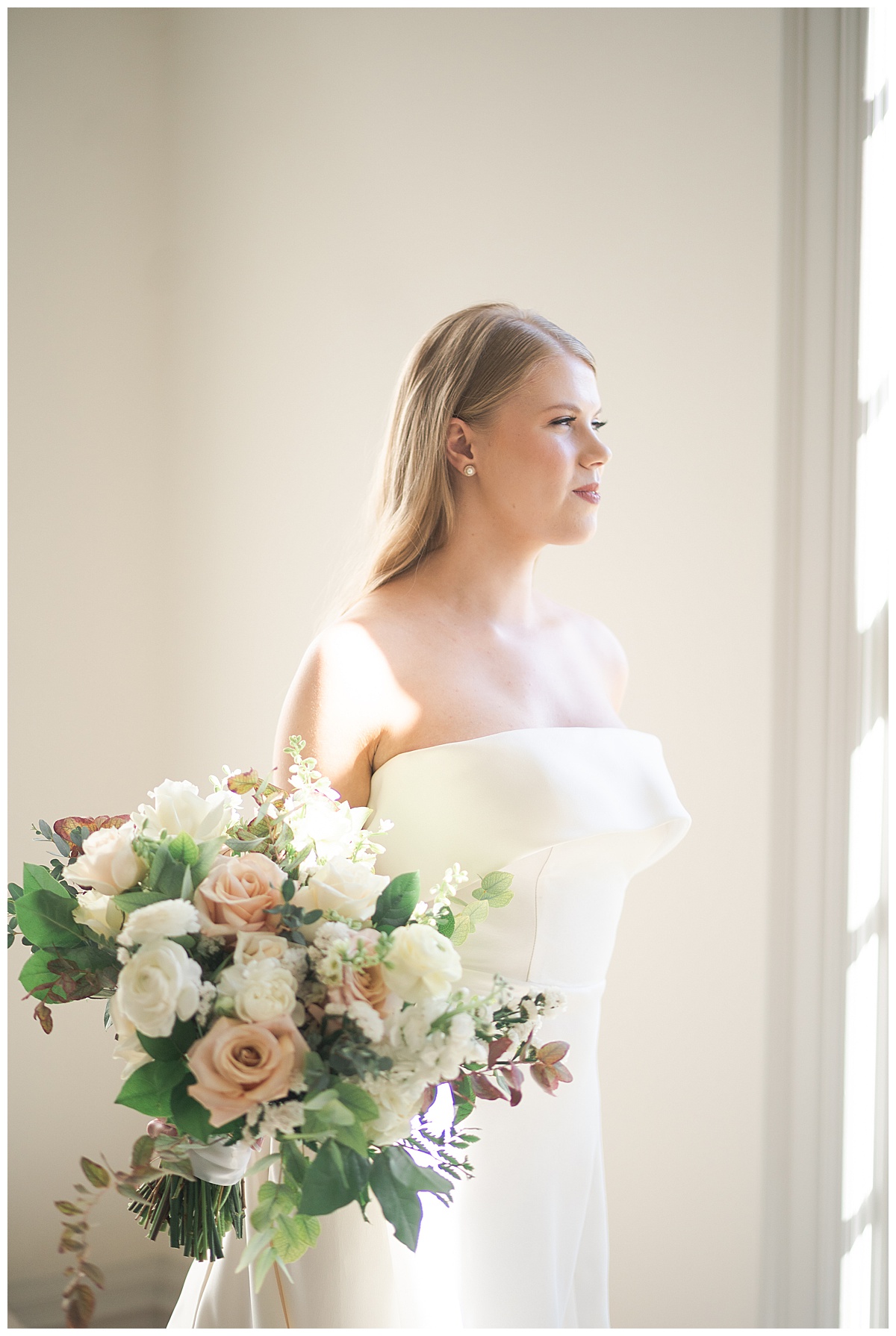 Stunning bride looks out in the distance for Swish & Click Photography