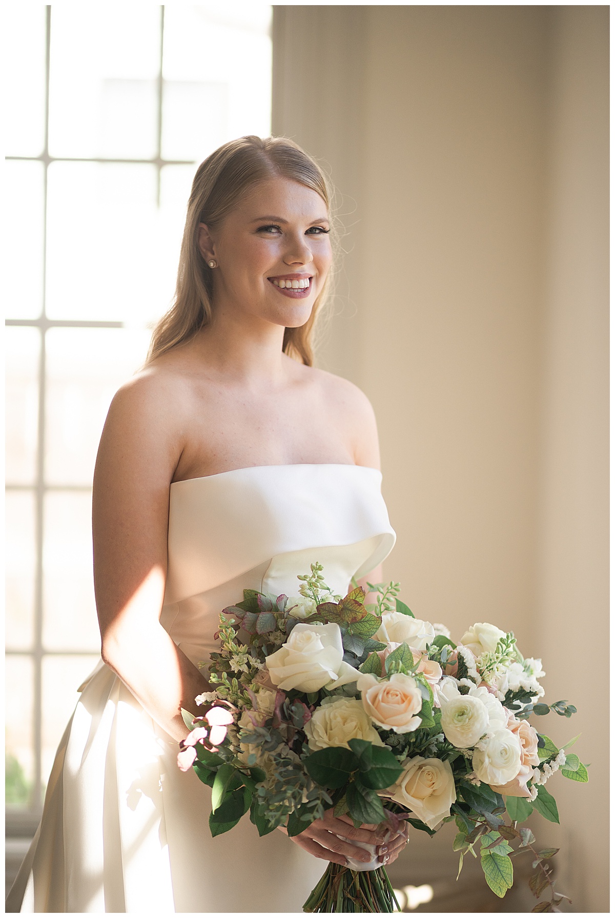 Gorgeous woman smiles big holding bridal bouquet for Stunning Bridal Portraits at The Creative Chateau