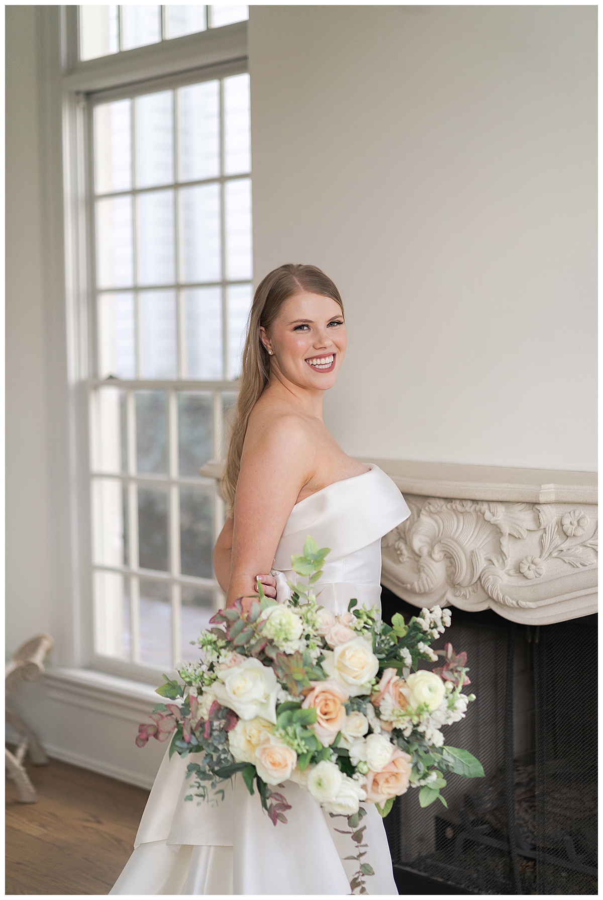 Gorgeous woman holds bridal bouquet and smiles big for Swish & Click Photography