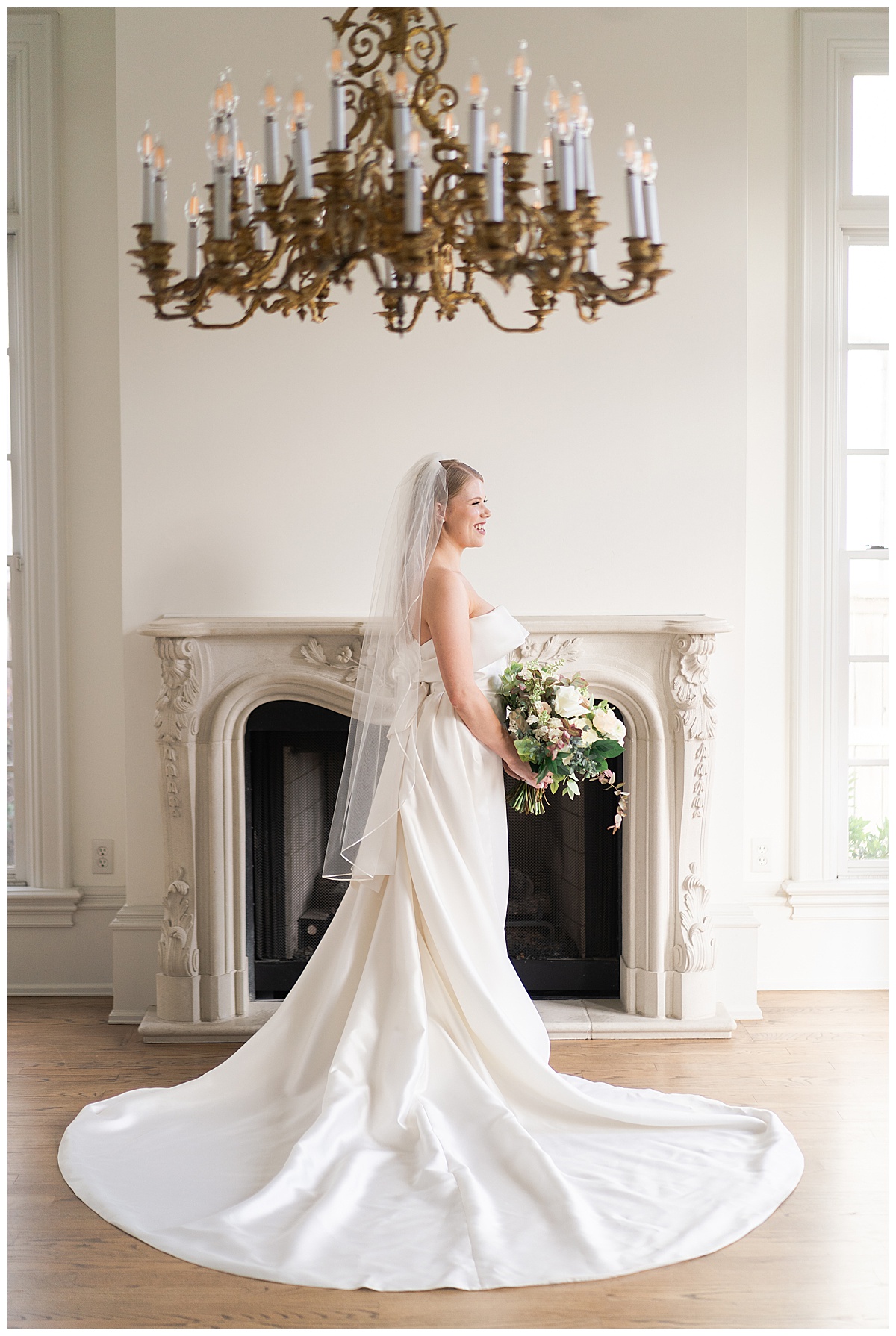Bride holds bouquet at stands in front of fireplace for Houston’s Best Wedding Photographers 