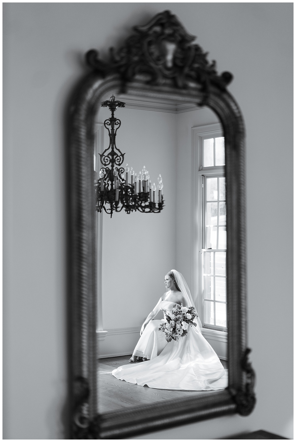 Antique mirror captures the reflection of bride smiling for Swish & Click Photography