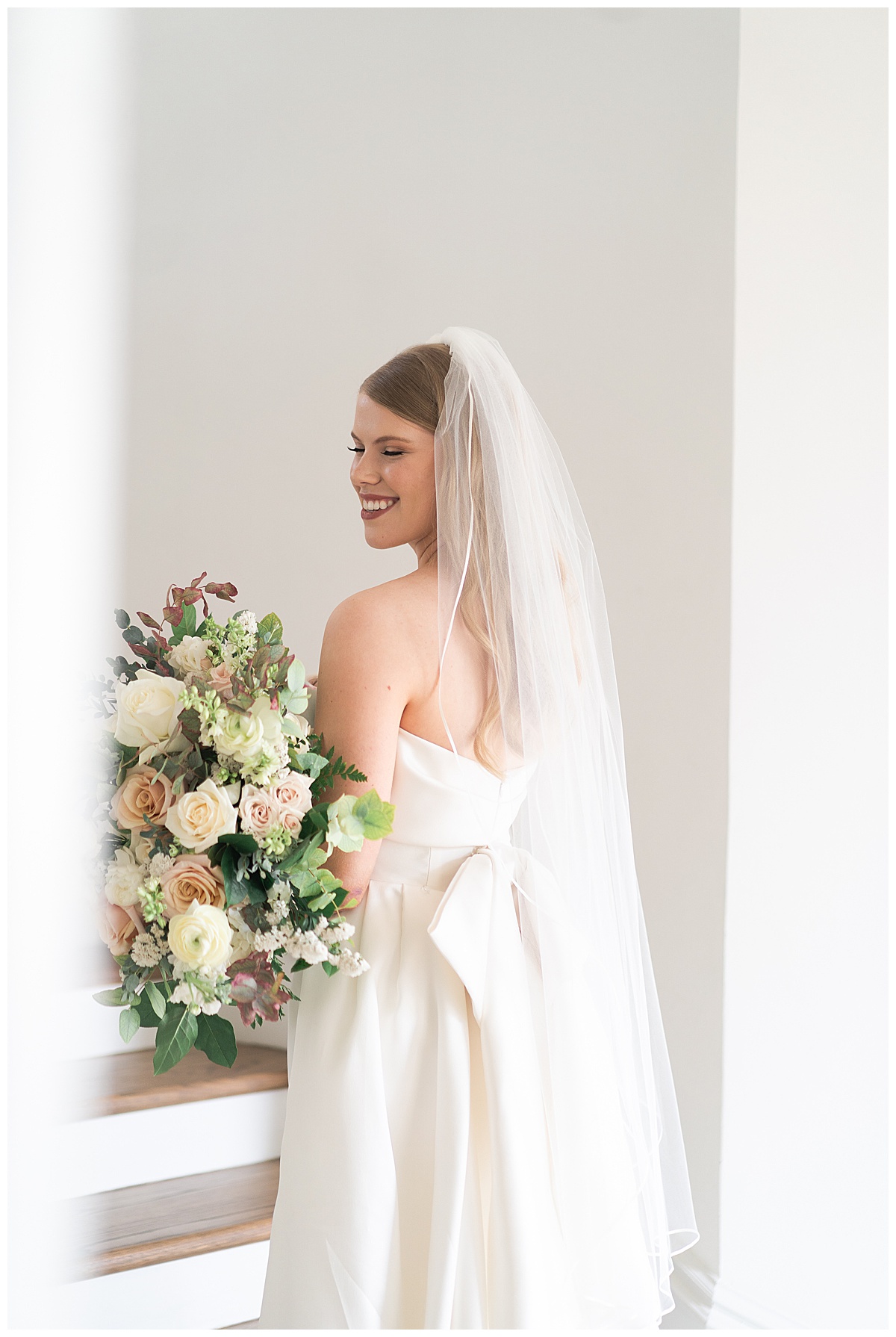 Stunning woman smiles big for bridal portraits by Swish & Click Photography