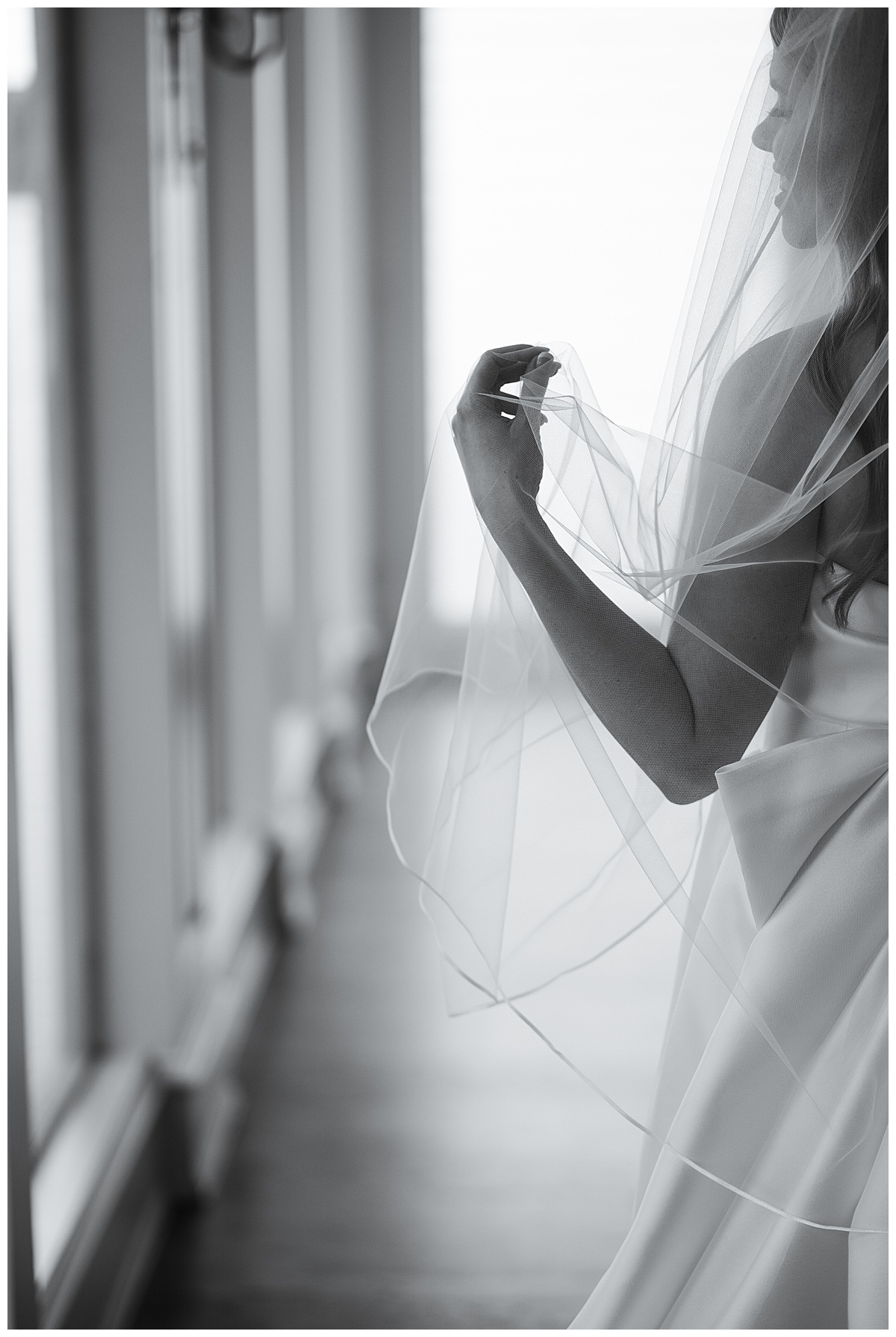 Woman pulls veil for Houston’s Best Wedding Photographers 
